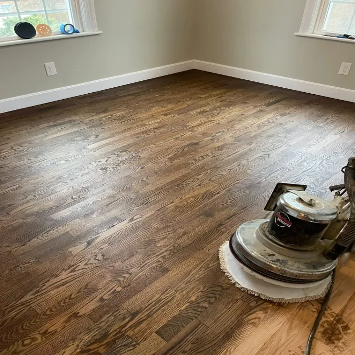 A hardwood floor being stained.