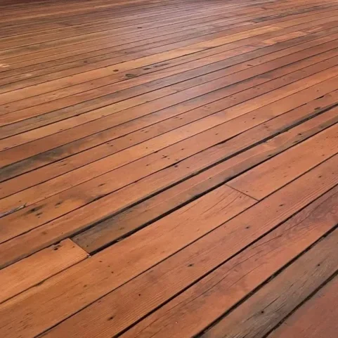 An after photo of a wooden floor that was refinished.
