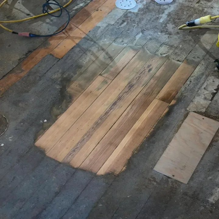 hardwood floorboards being refinished.