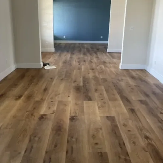Empty living room with new LVP flooring.