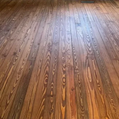 Wooden floor with natural grain and finish.