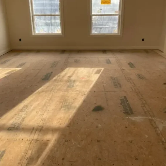 Empty room highlighting a subfloor.