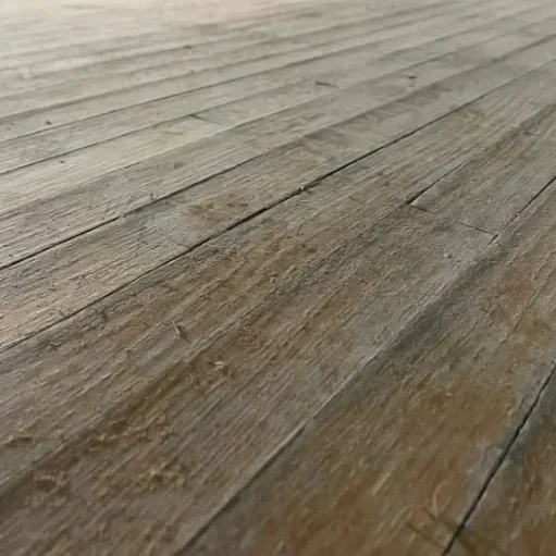 Close-up of wooden floorboards before refinishing.