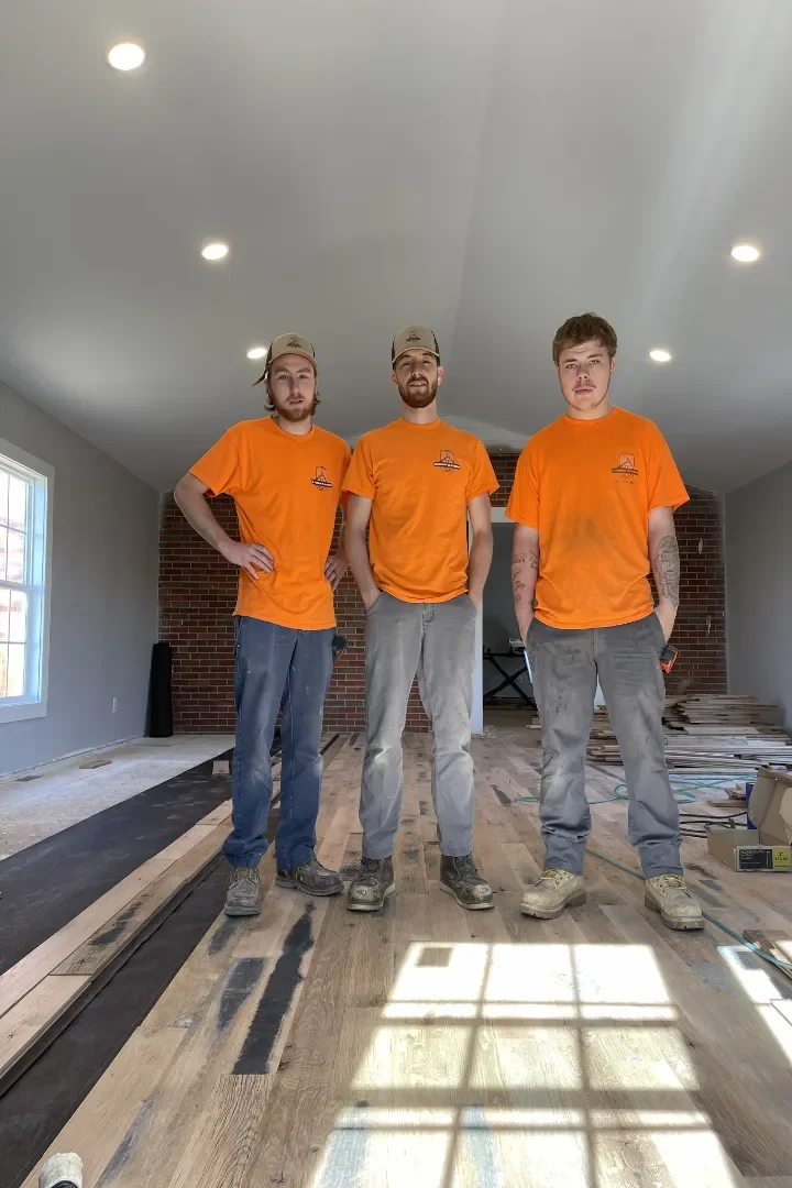 Owner pictured in the center with his crew on each side.