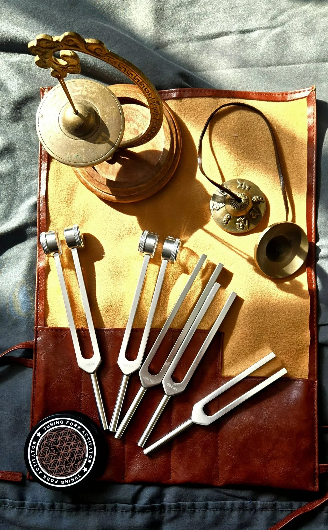 A collection of tuning forks, and other sound healing tools