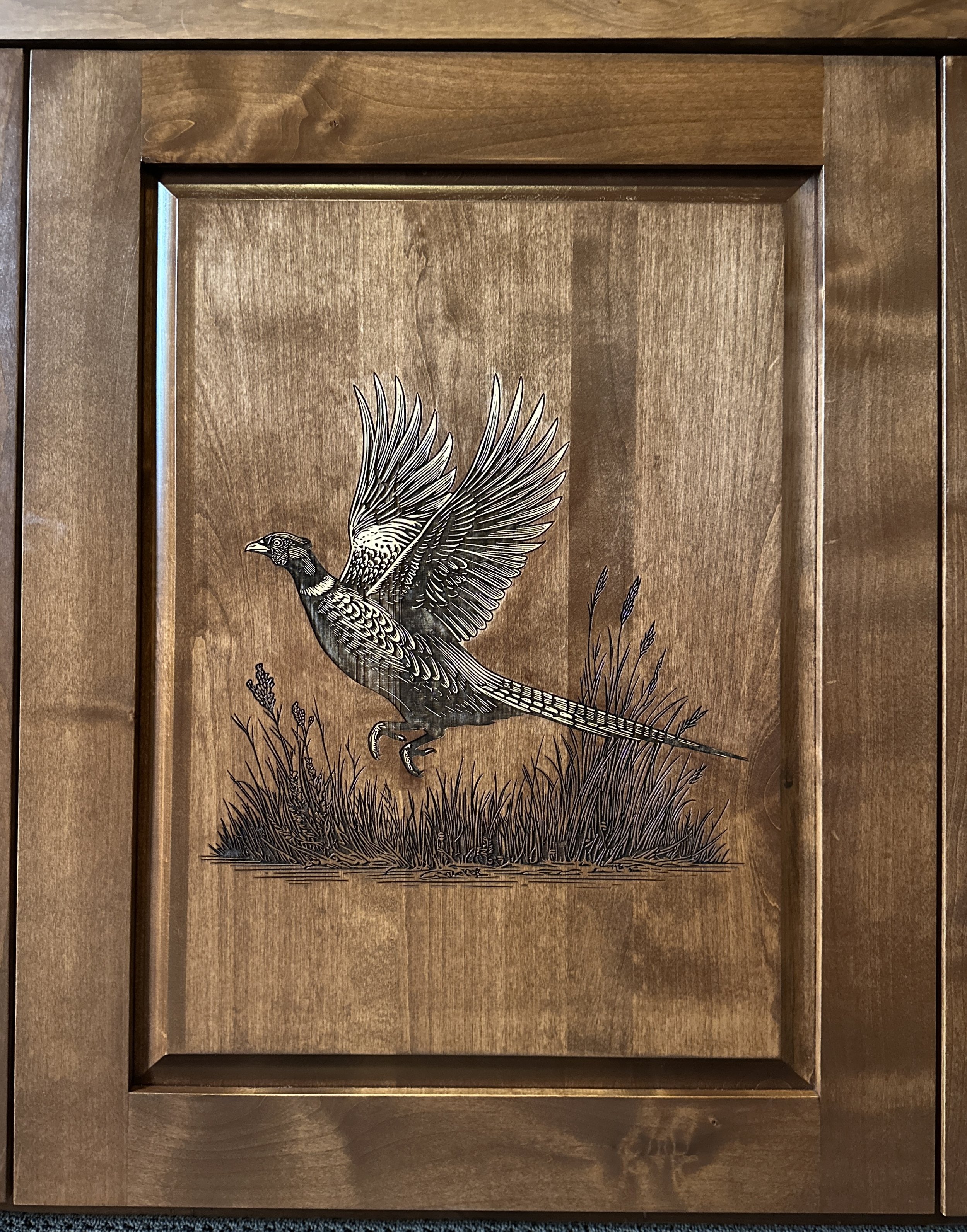 Wooden wall art depicting a bird with outstretched wings standing in grass.