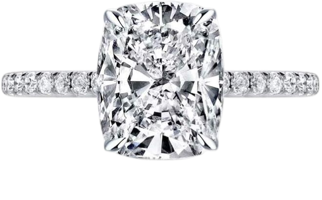 Close-up of a diamond engagement ring with a large cushion-cut diamond and a band of smaller diamonds.