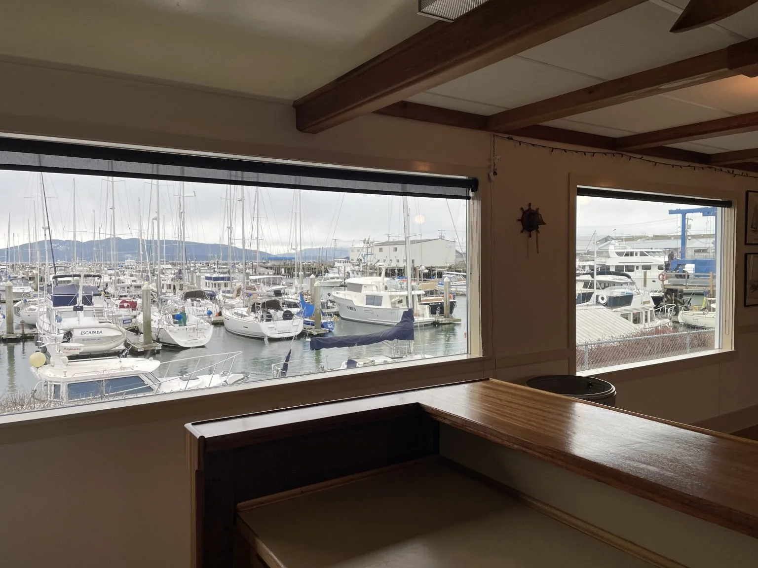 Large window overlooks the waterfront from the Squalicum Yacht Club rental clubhouse