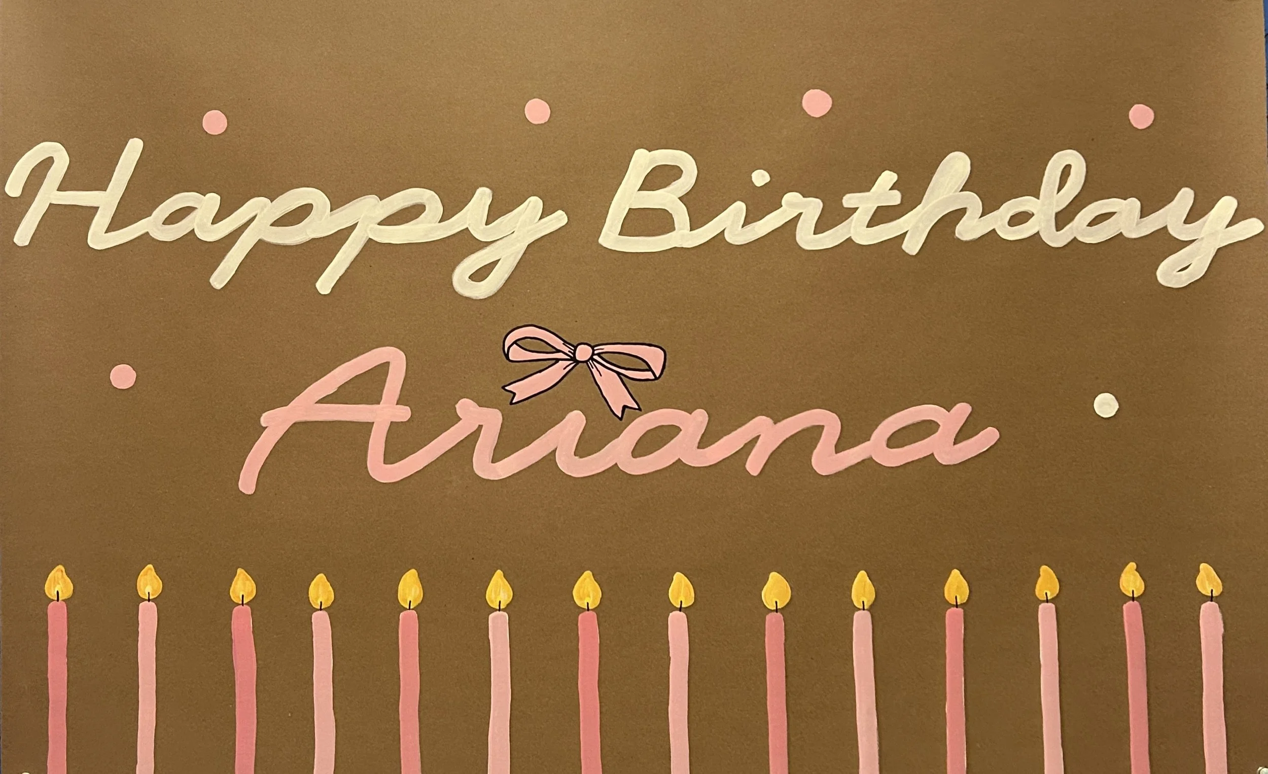 Decorative birthday banner with the message 'Happy Birthday Aurora' and pink candles with yellow flames at the bottom.