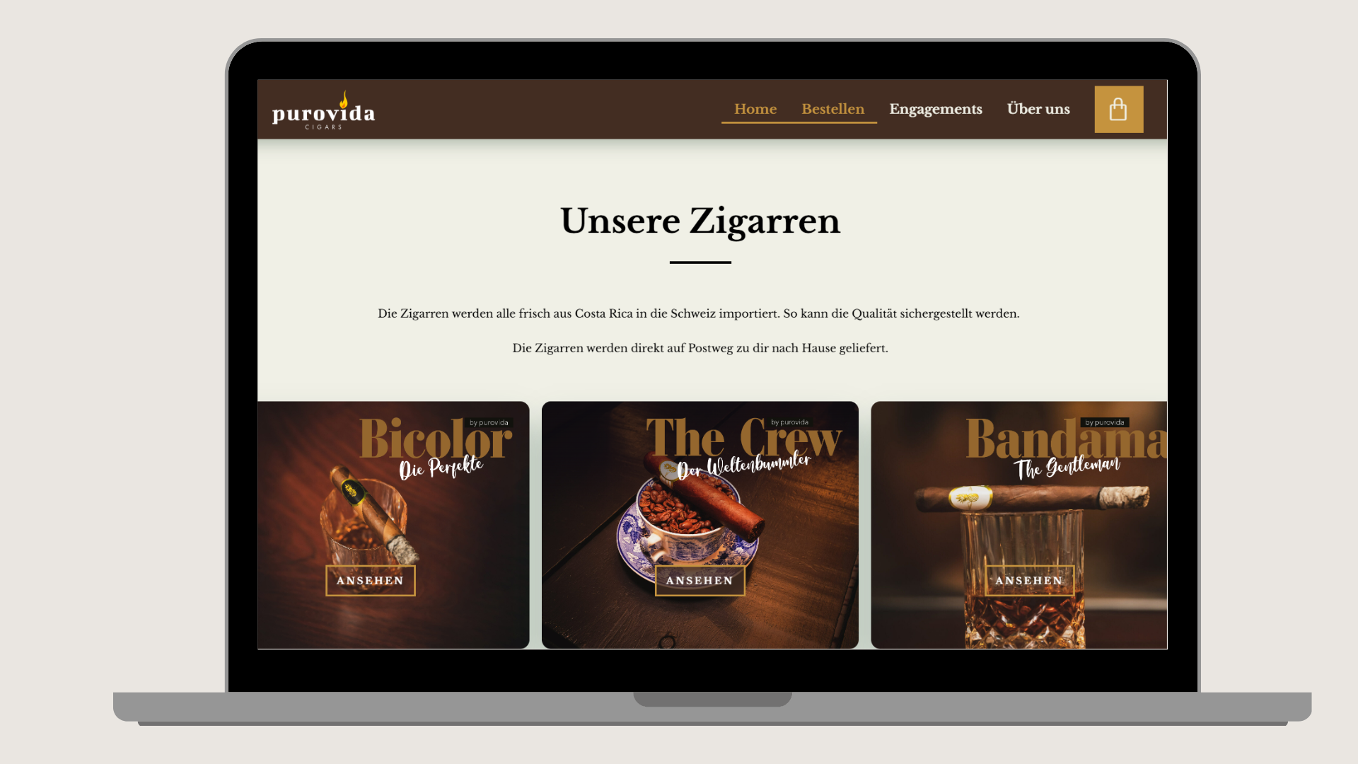 Laptop screen displaying a website for Purovida cigars with images of three different cigars labeled Bicolor, The Crew, and Bandama, each with an 'ANSEHEN' button.