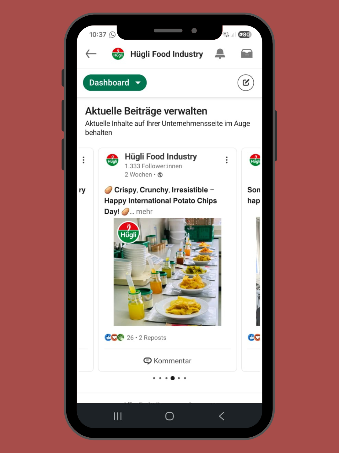 A smartphone screen displaying a Facebook post by Hügli Food Industry celebrating International Potato Chips Day with a photo of plates of potato chips and small jars of sauces or dips on a table.