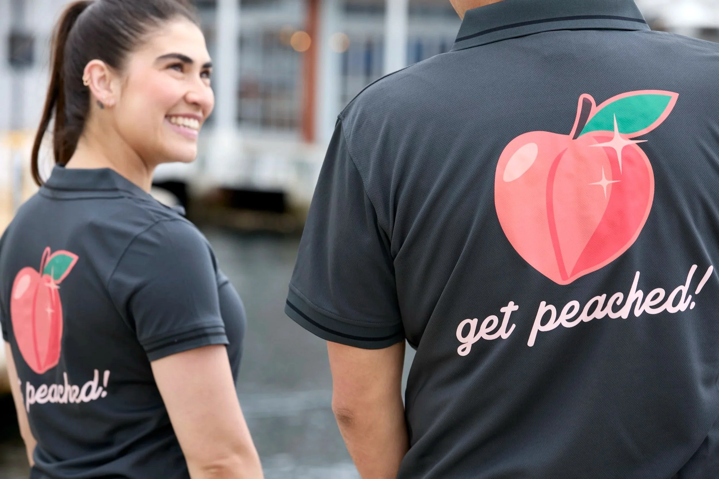 Peachie Clean team members in Hobart wearing branded uniforms with peach logo, representing professional commercial cleaning services