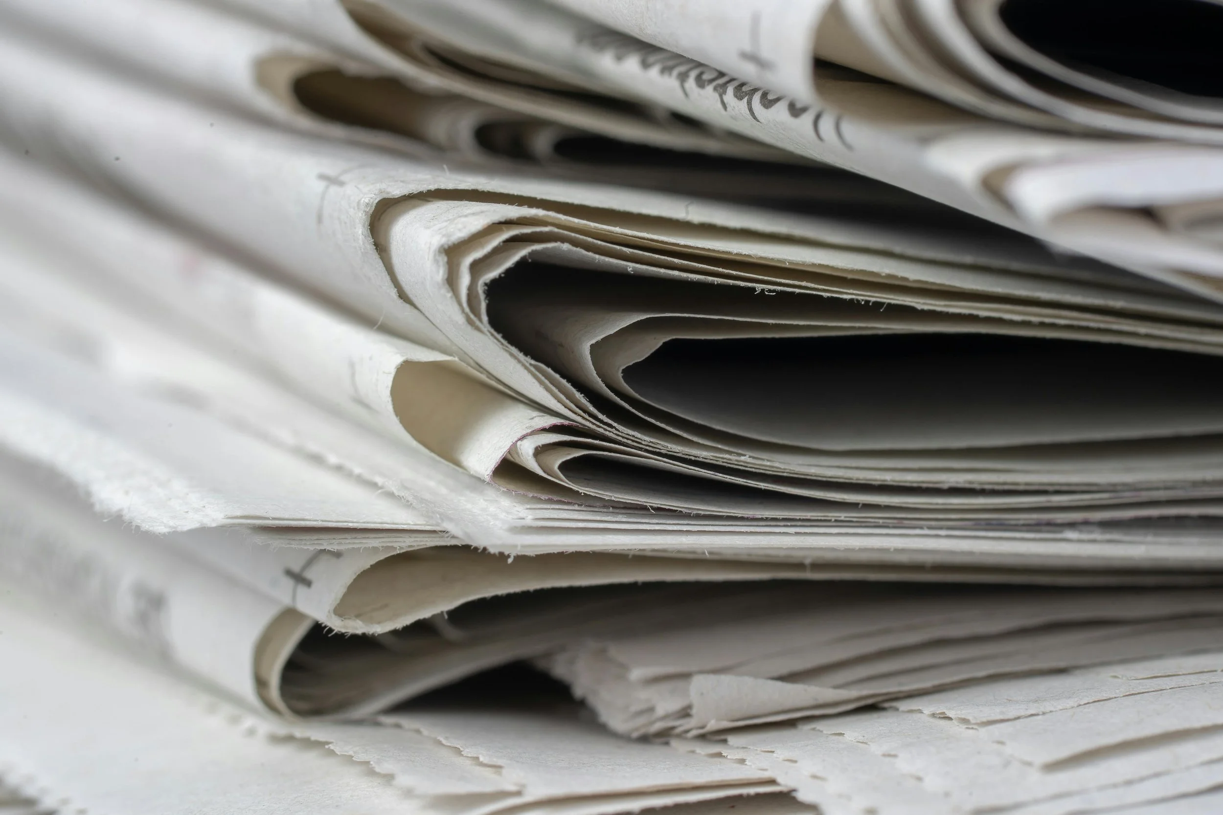 Stack of crumpled newspapers.