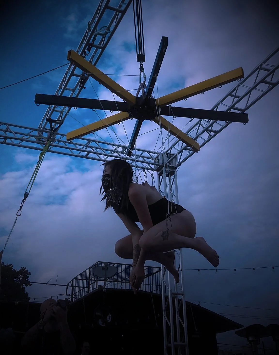 Body suspension on top of a bar in Deep Ellum Dallas, Texas.