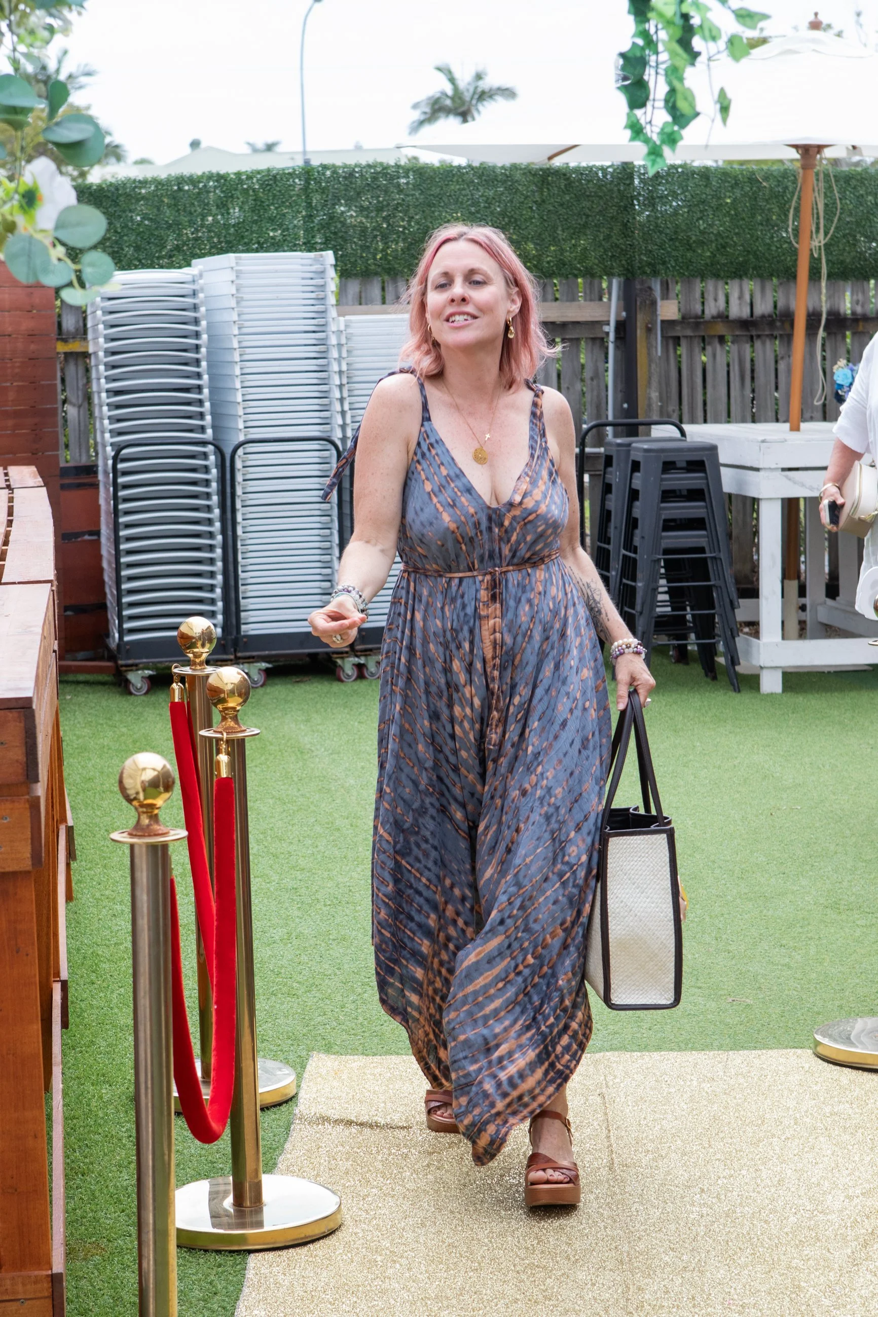 A women confidently walking into a Melbourne Bra less brunch event
