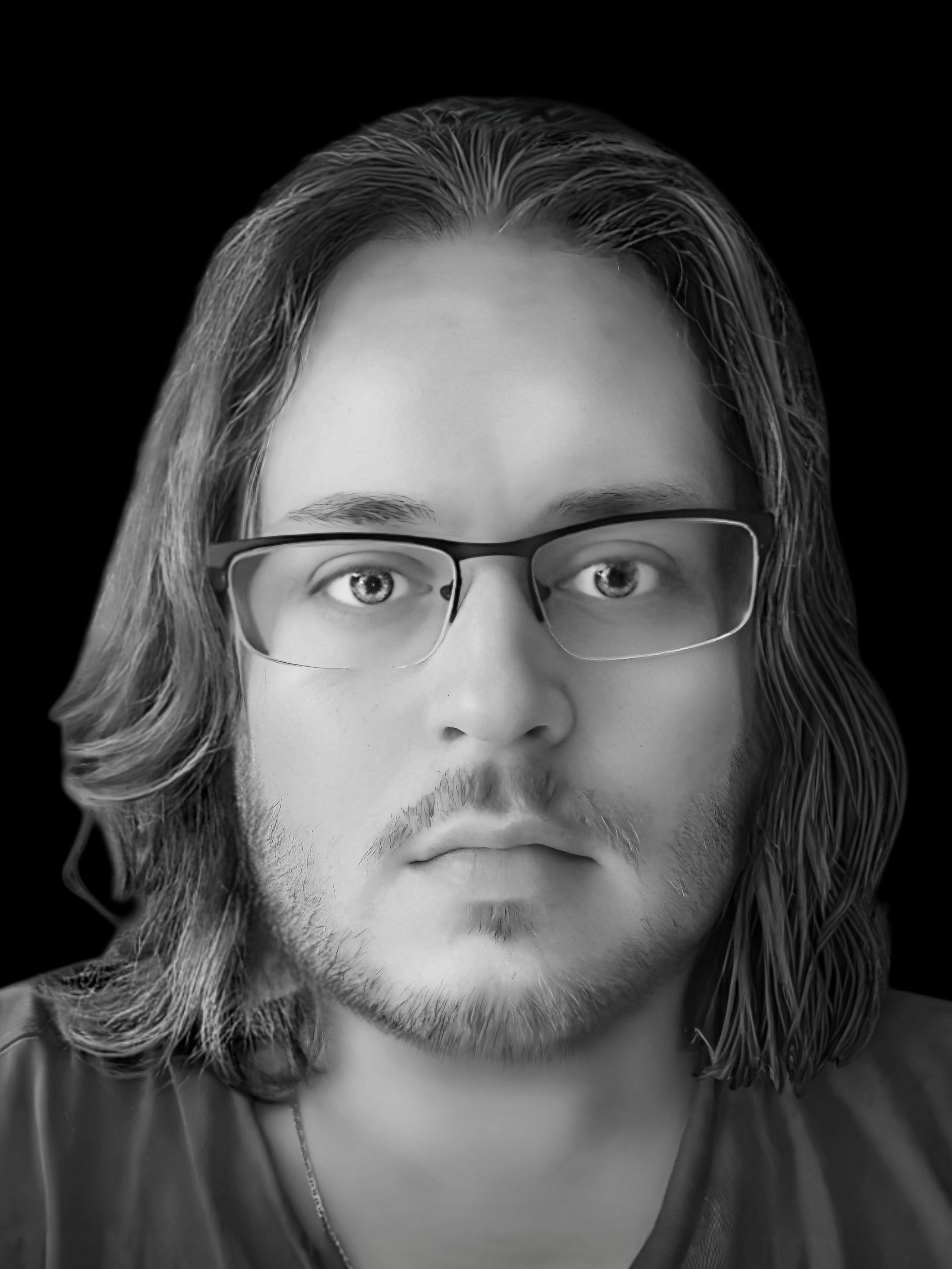 Black and white close-up photograph of a young man with shoulder-length hair, glasses, and a light beard and mustache.