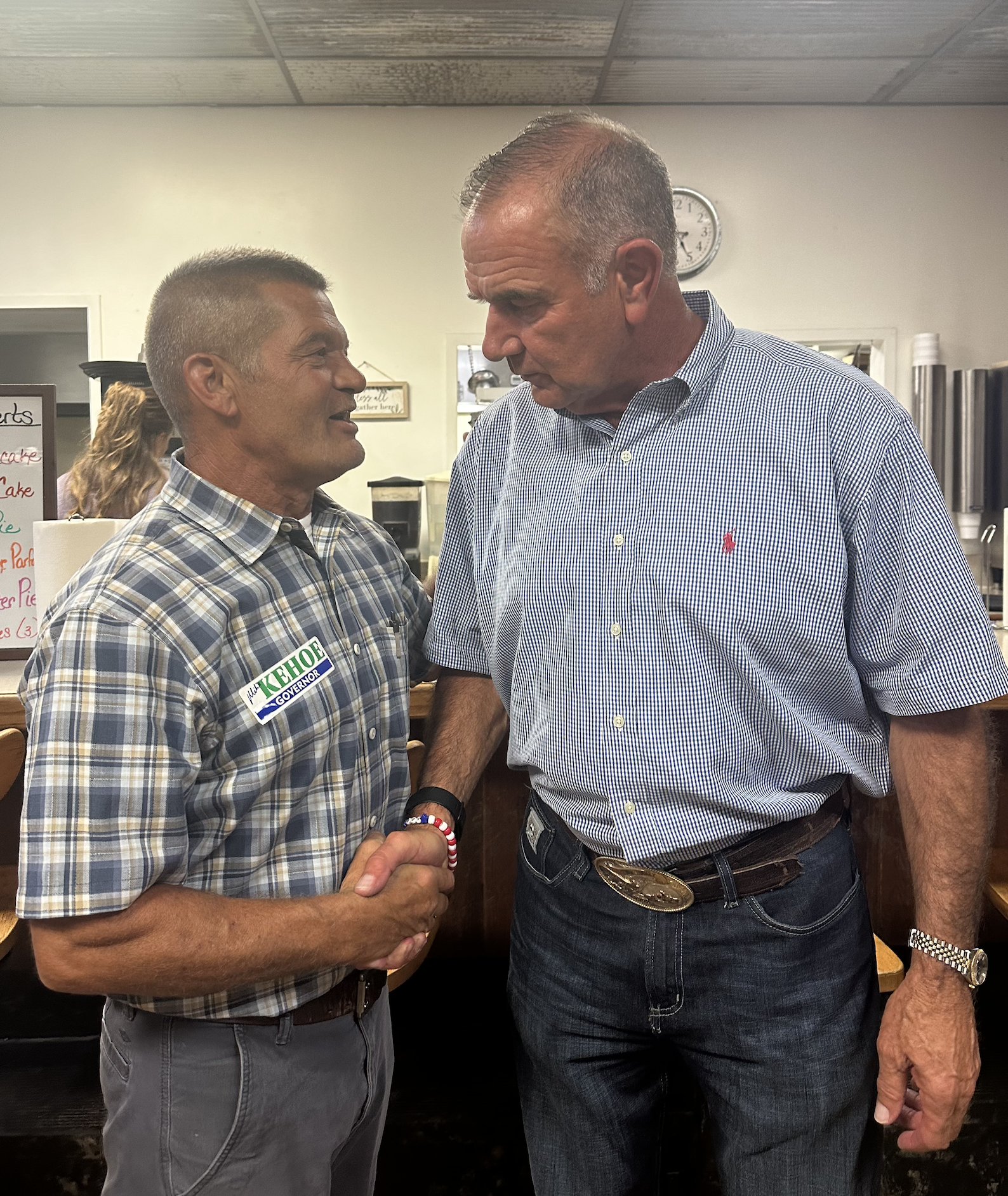 With Governor Mike Kehoe