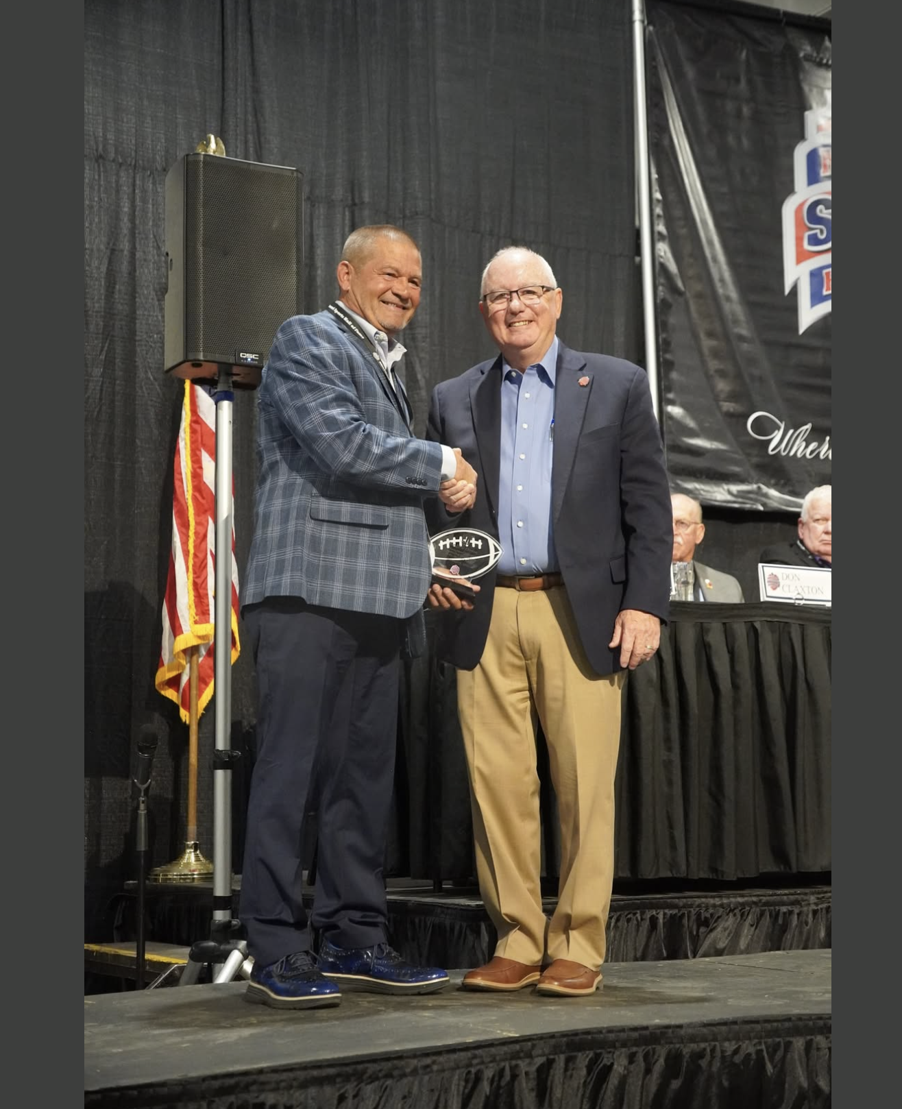 Carl Junction's Roger Koch accepts the Elite 11 Award from MO Sports Hall of Fame Chairman Dan Nelson
