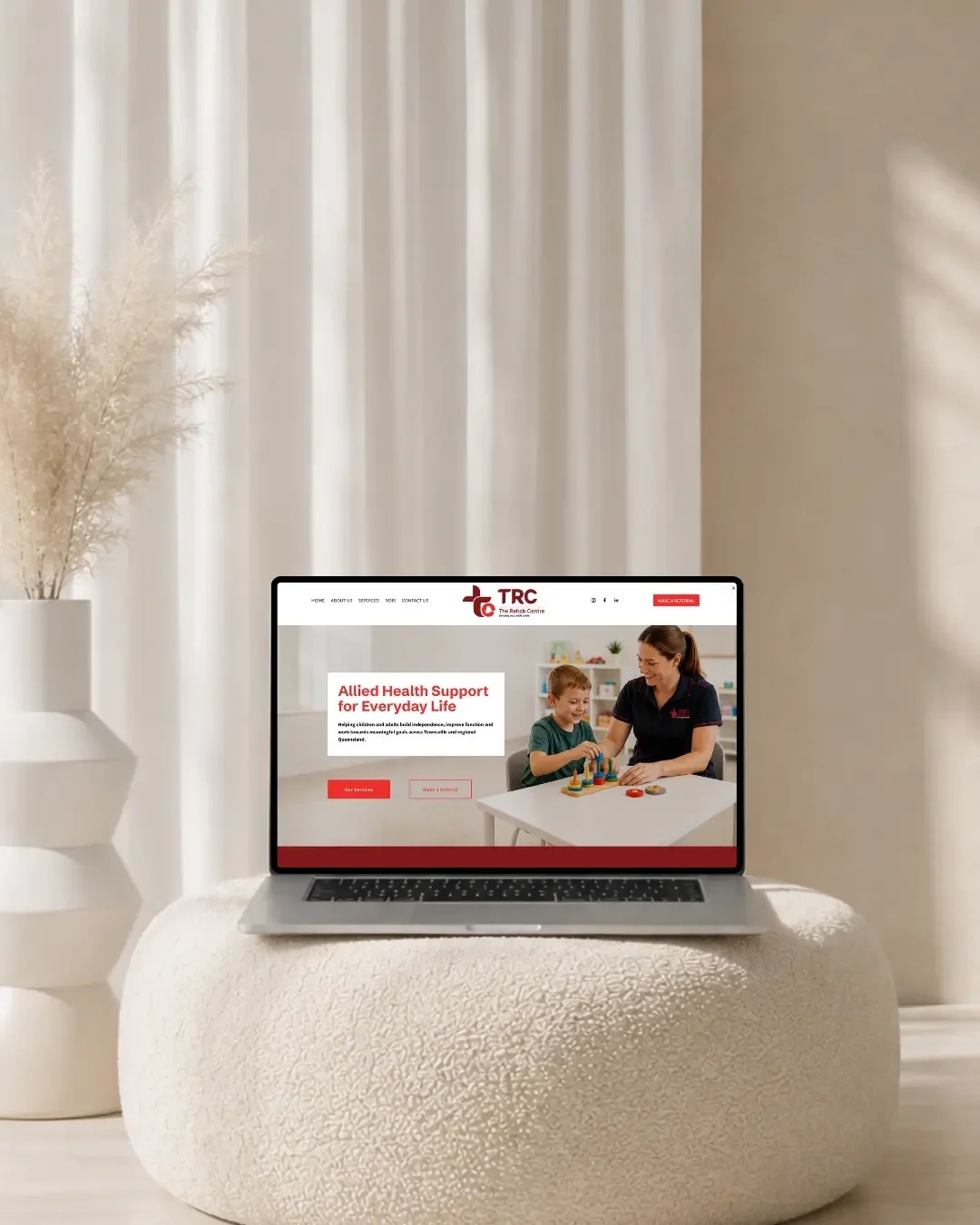 The Rehab Centre Townsville website design displayed on a laptop mockup
