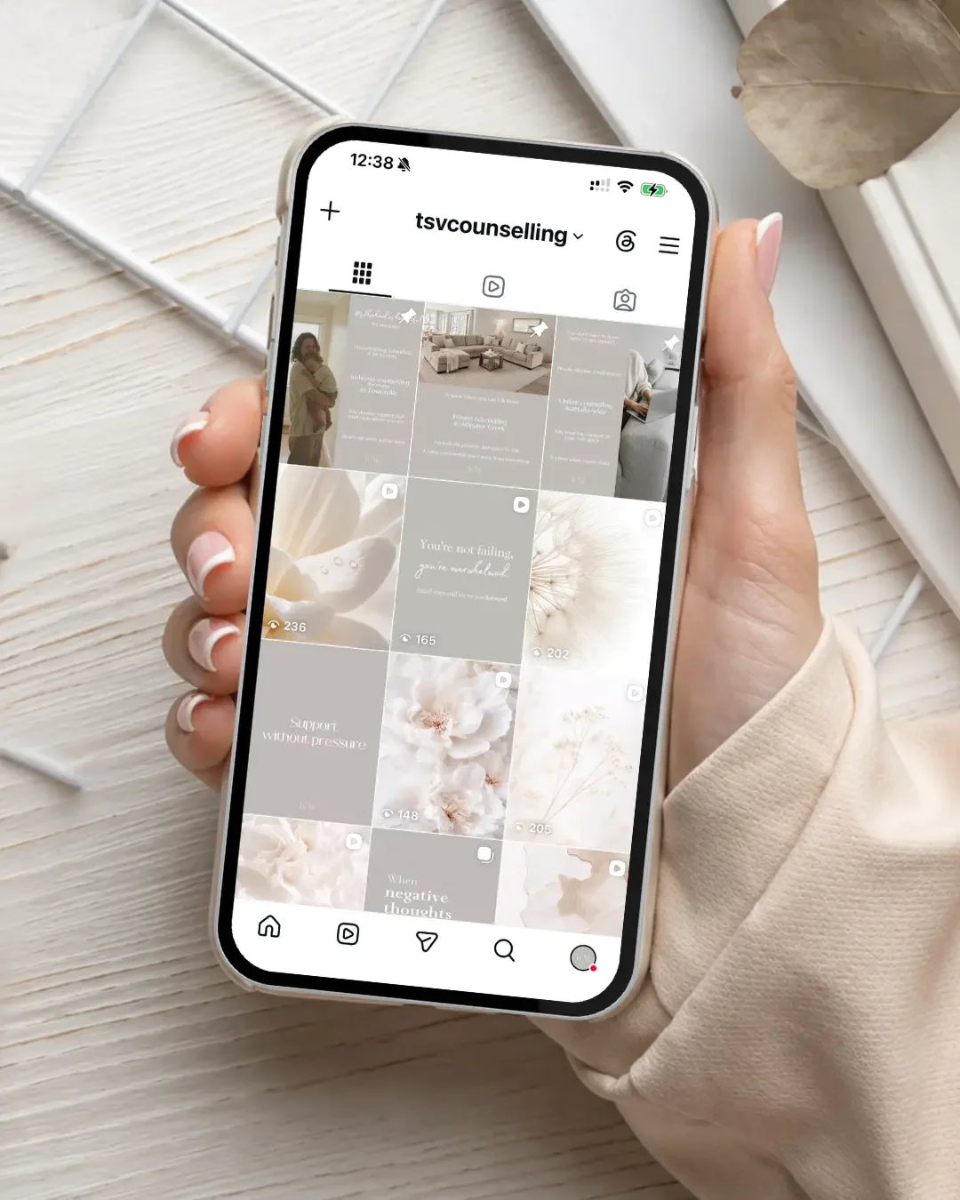Instagram social media content for Townsville Counselling & Wellness displayed on smartphone, showing calm counselling branding and mental health support content