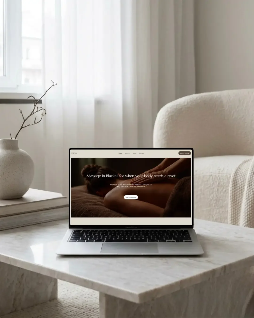 Massage With Michelle Blackall website design displayed on a laptop mockup