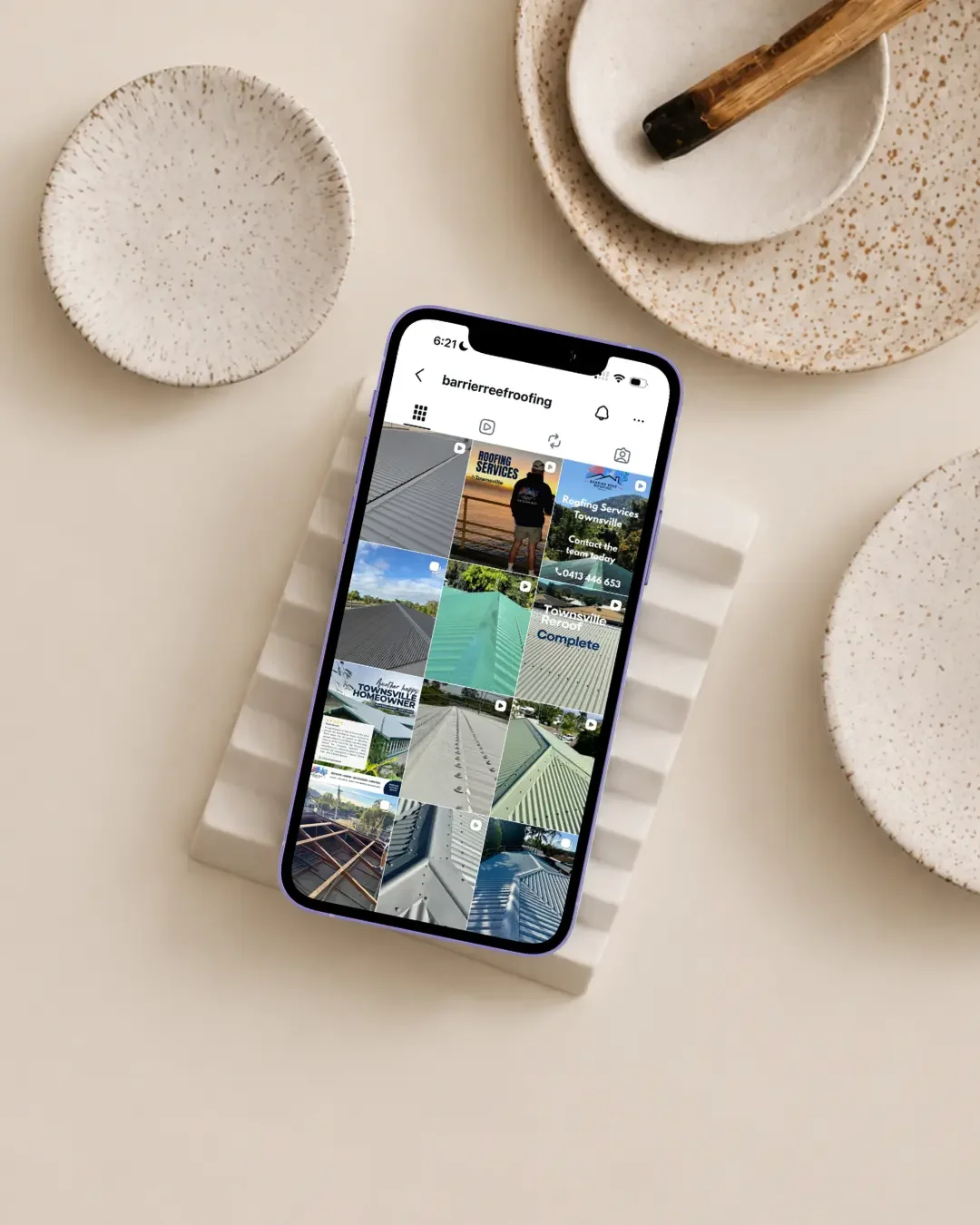 Barrier Reef Roofing Instagram feed showing roofing projects and branded social media content for Townsville