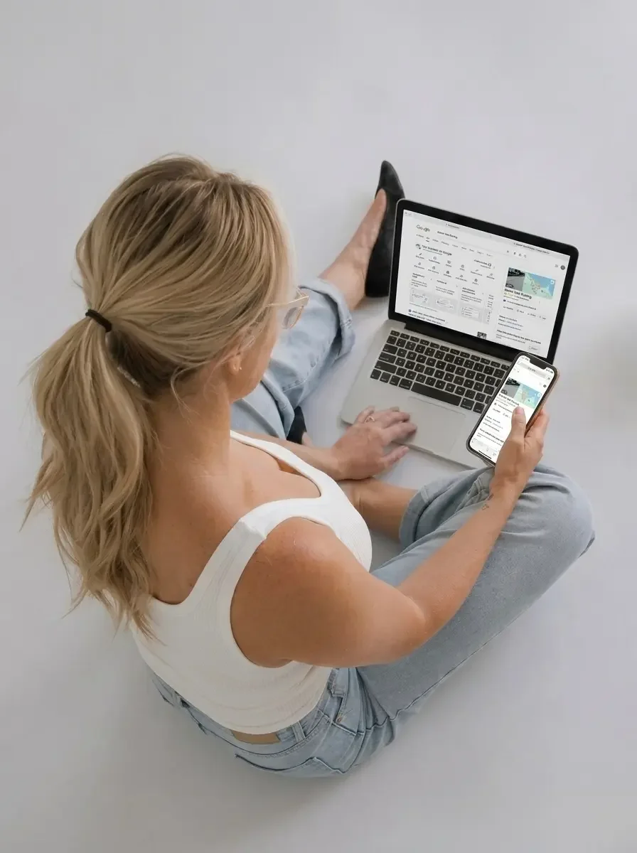 Business owner searching Google on a laptop to understand why their Townsville business is not appearing in local search results.