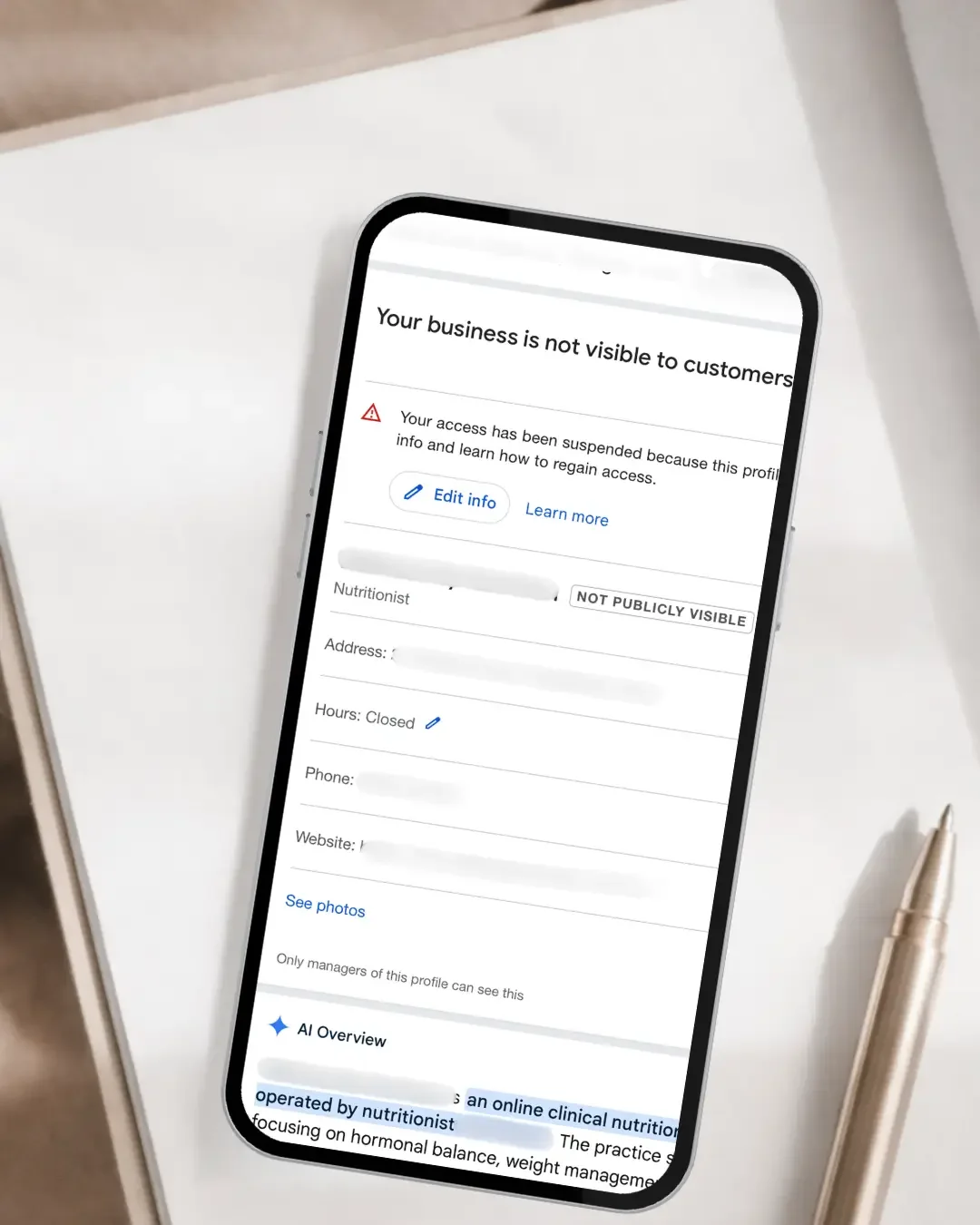 Google Business Profile suspended listing shown on mobile device for Townsville business recovery support