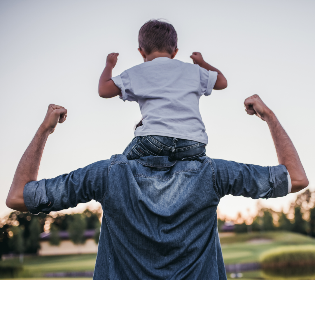 Young boy sitting on mans shoulders. Both flexing. Facing away from the camera