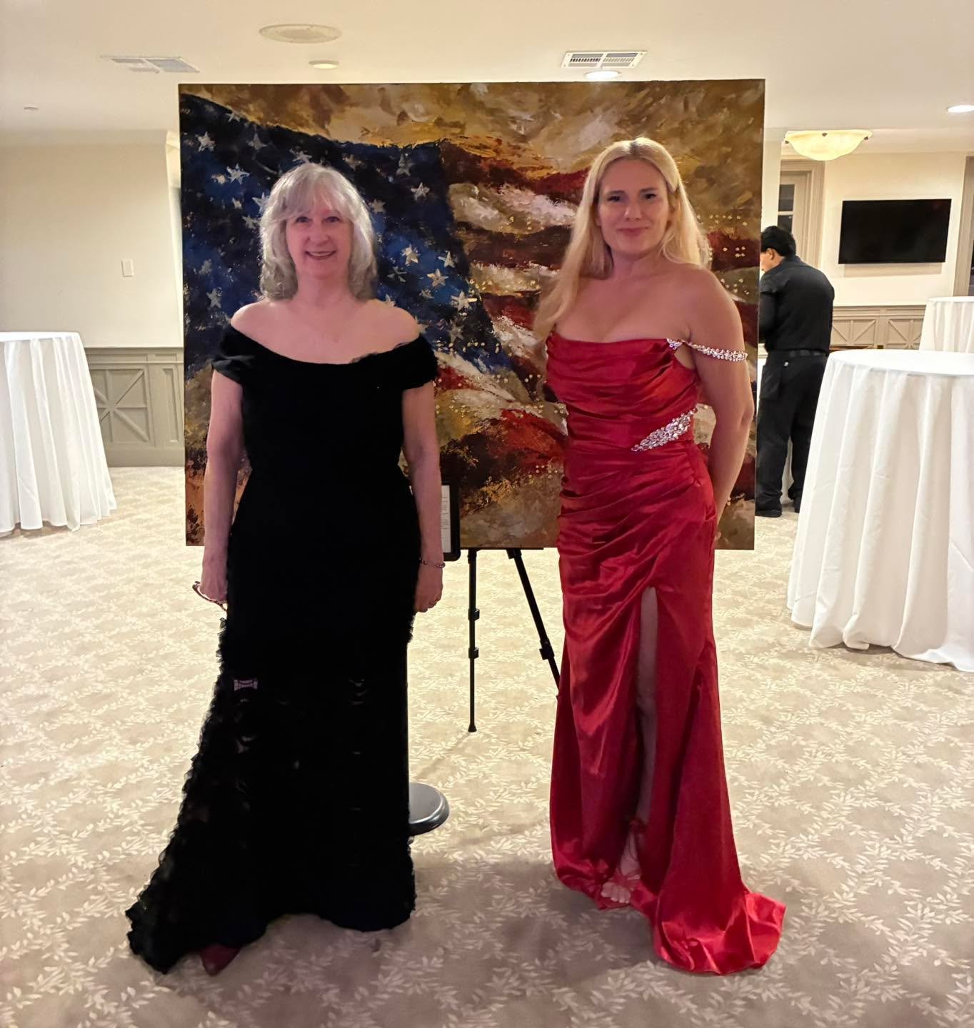Laura, a Favarh Thrift Shop customer, needed a dress for a nonprofit gala and turned to Favarh before heading out to shop. She found this stunning black dress for $25 and no one would ever know. Posing with celebrities and the artist that created the