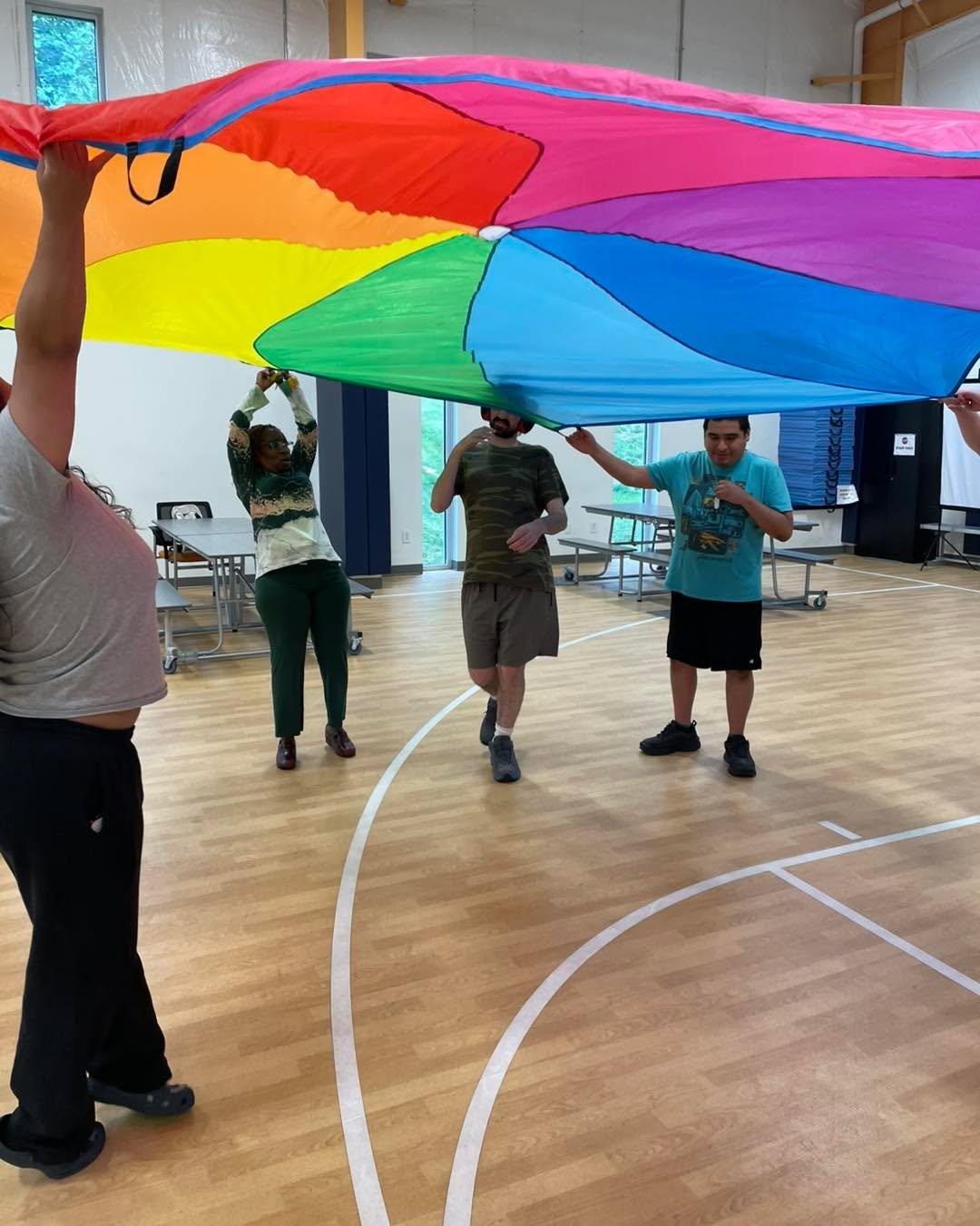 When it&rsquo;s hot outside we have all the fun indoors! Enjoy these great pics of the staff and individuals from Favarh&rsquo;s Day Program ALEP having fun with the parachute at the Wellness Center.