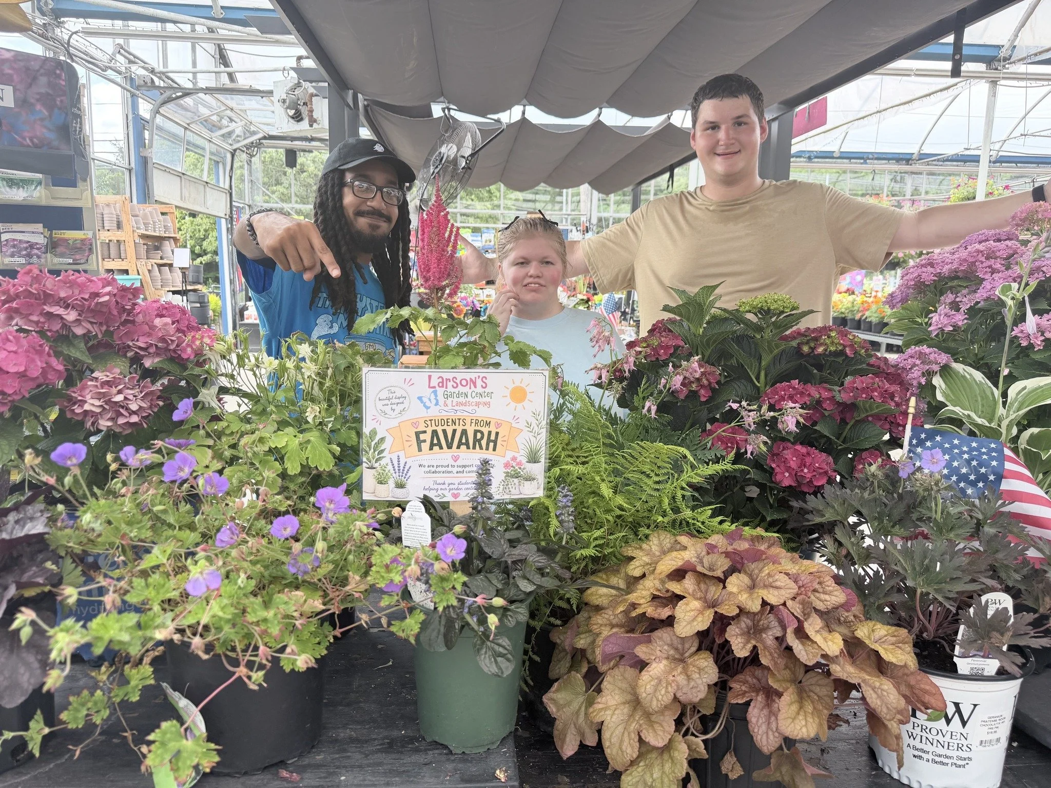 Favarh Transition students returned for summer programming and have been given the opportunity to learn new employment skills at @larsonsgardencenter  Center in Burlington. 

Their sign reads, " This Beautiful Display was designed by students fr