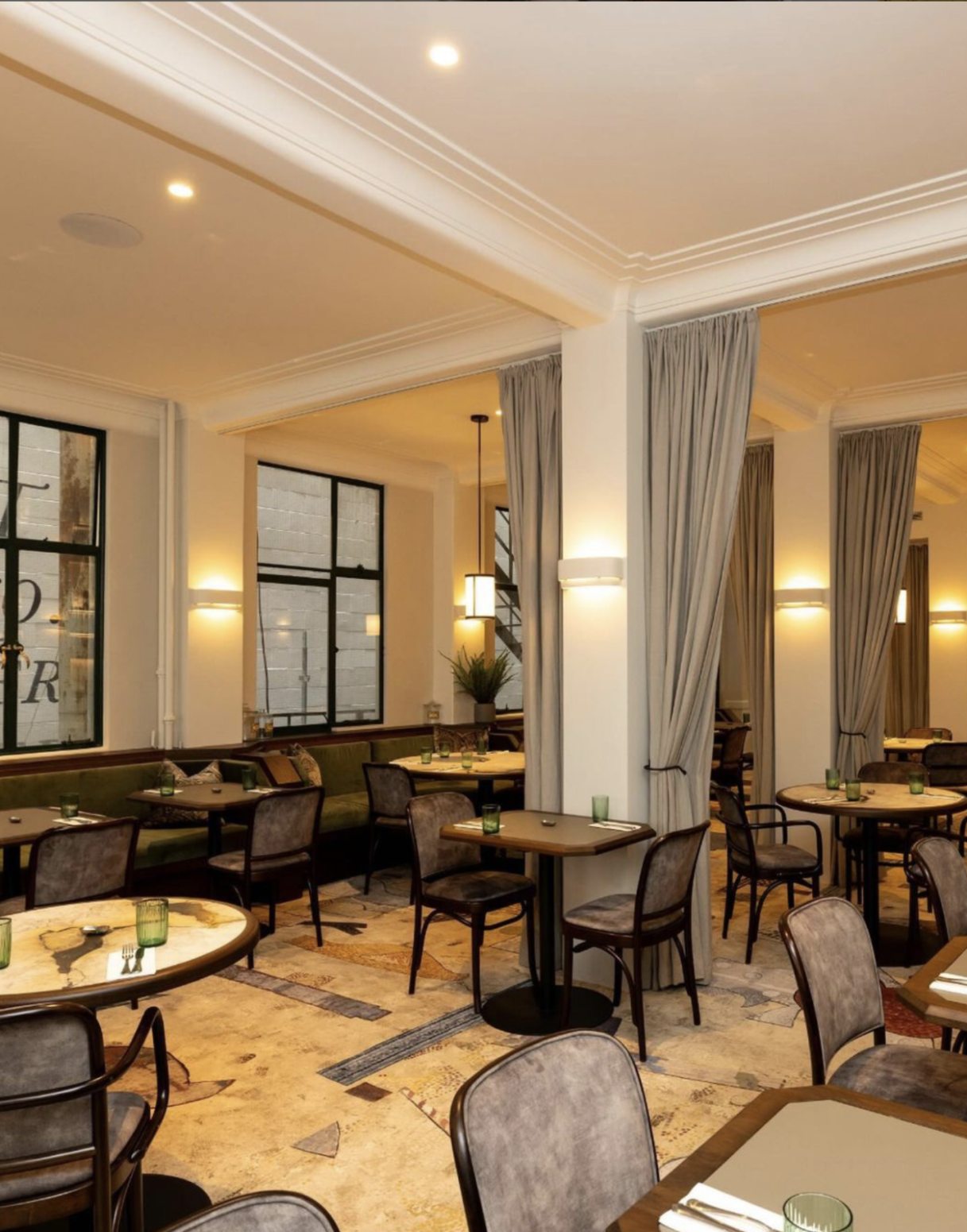Modern restaurant interior with tables, gray dye-injected carpet, and soft lighting