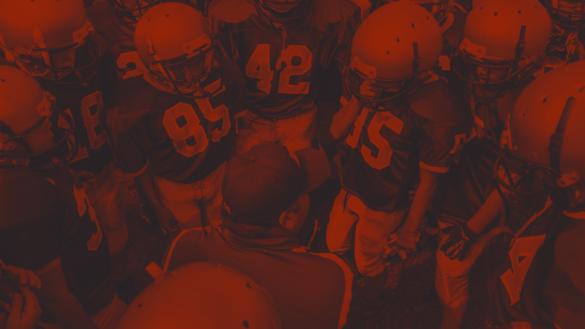 Football Coach talking to team