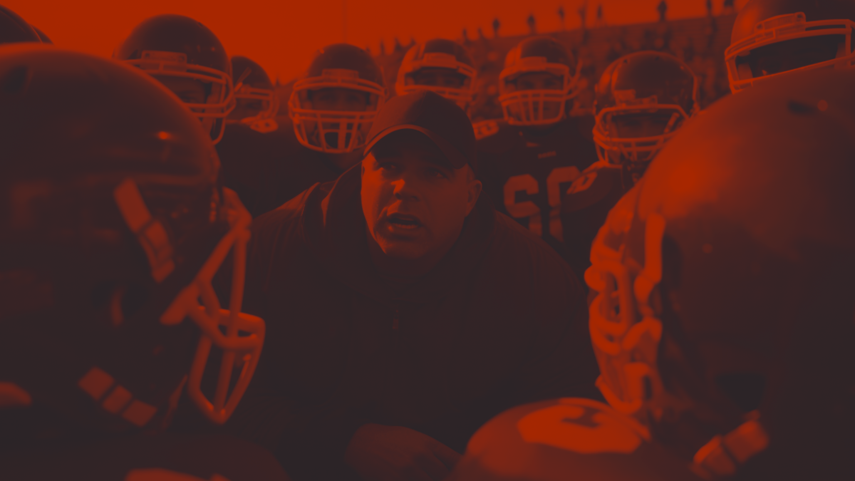Football Coach talking to team