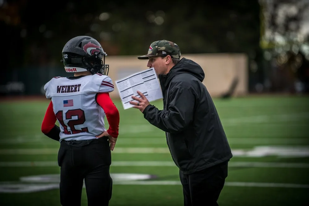 Red Wolves Football Coach Talking to Player