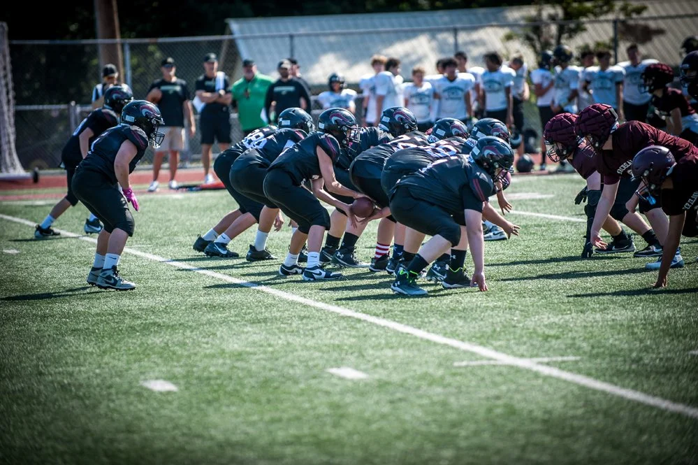 Young football players line up for a play.