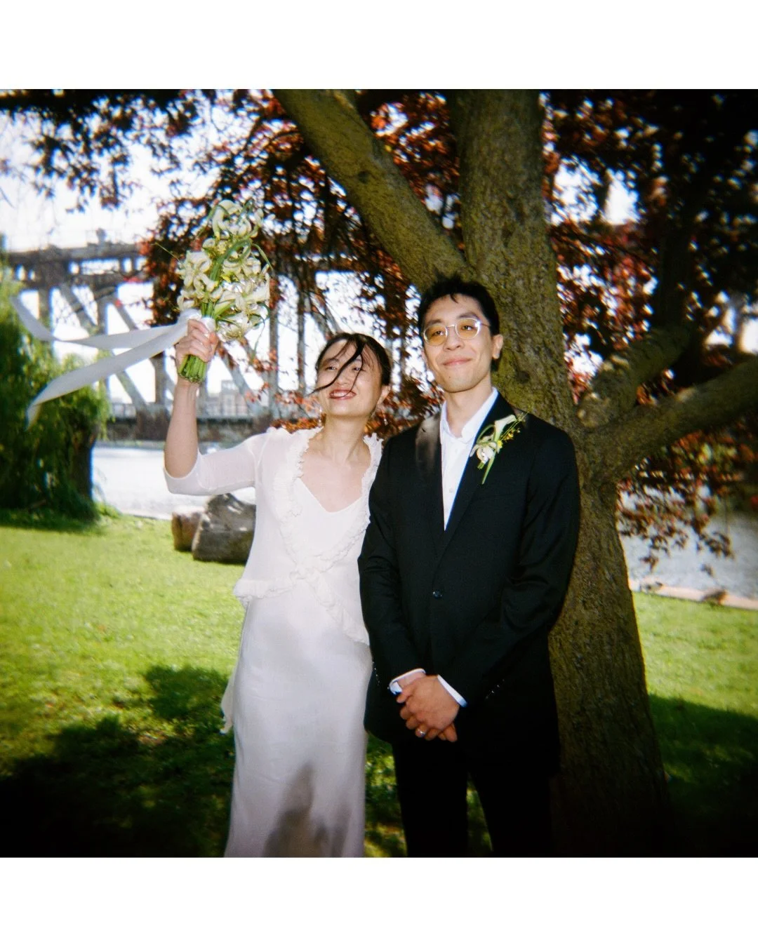 For Emily &amp; Josh ❣️
Quietly married in ping tom park under their favorite tree
Adorned with florals by @nerinefloral 

#35mm #chicagobridetobe #chicagofilmphotographer #chicagowedding #chicagoweddingphotographer