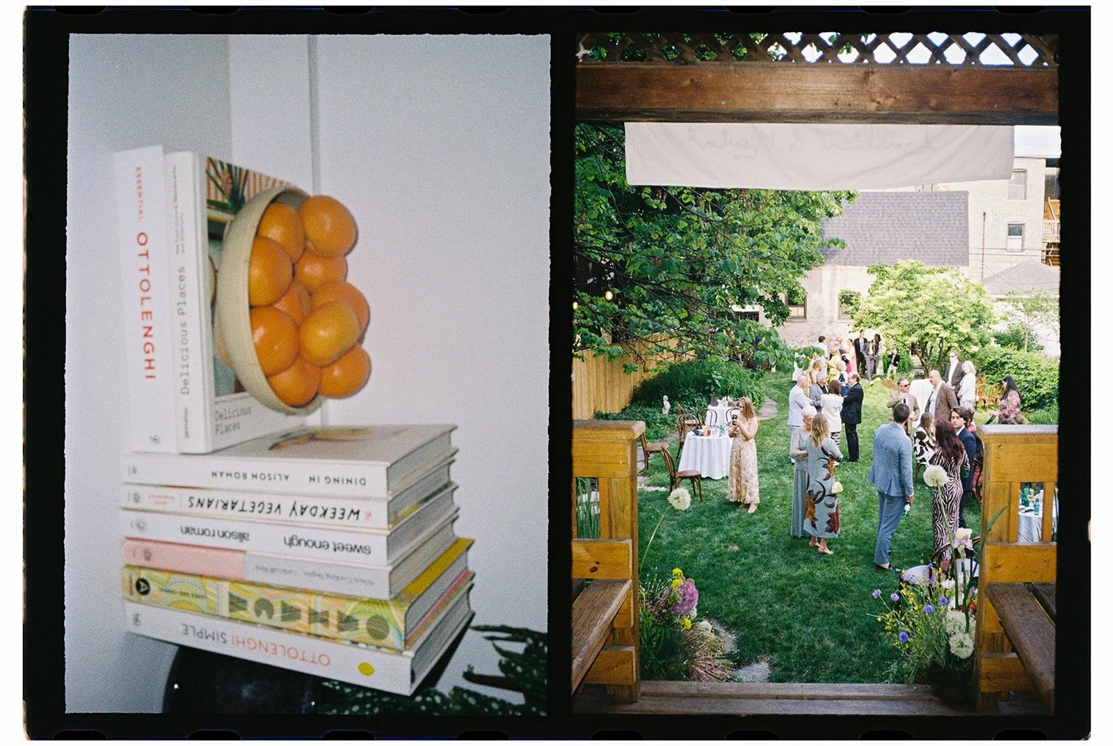 View of a backyard gathering with people socializing and trees, seen through a window. Inside, on a white table, there is a stack of books and a bowl of oranges.