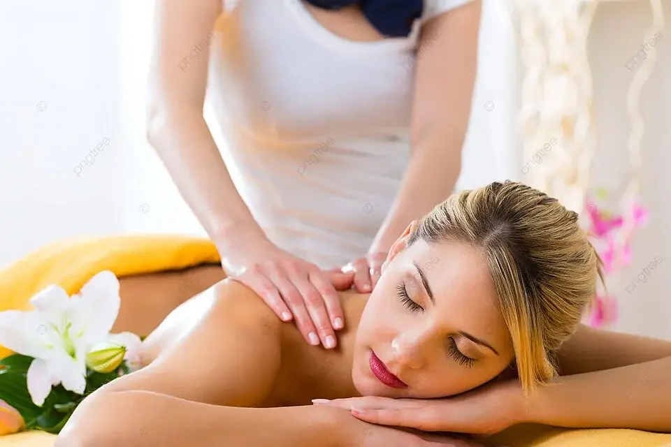 Woman receiving a professional neck and shoulder massage from a massage therapist.