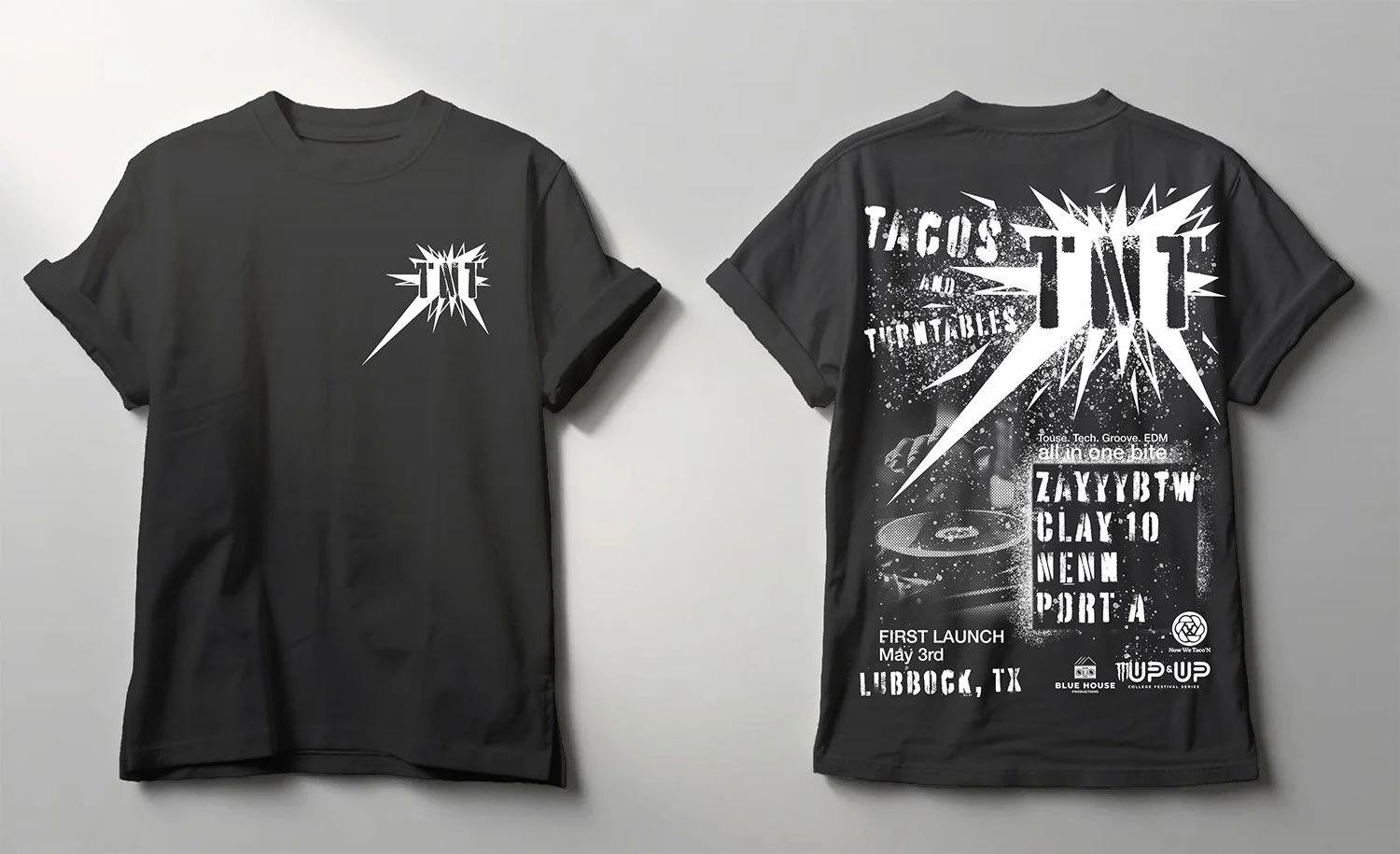 Two black T-shirts displayed flat; the front of the left shirt and the back of the right shirt show graphic designs related to an electronic music event, with bold text, splatters, and a record player graphic.