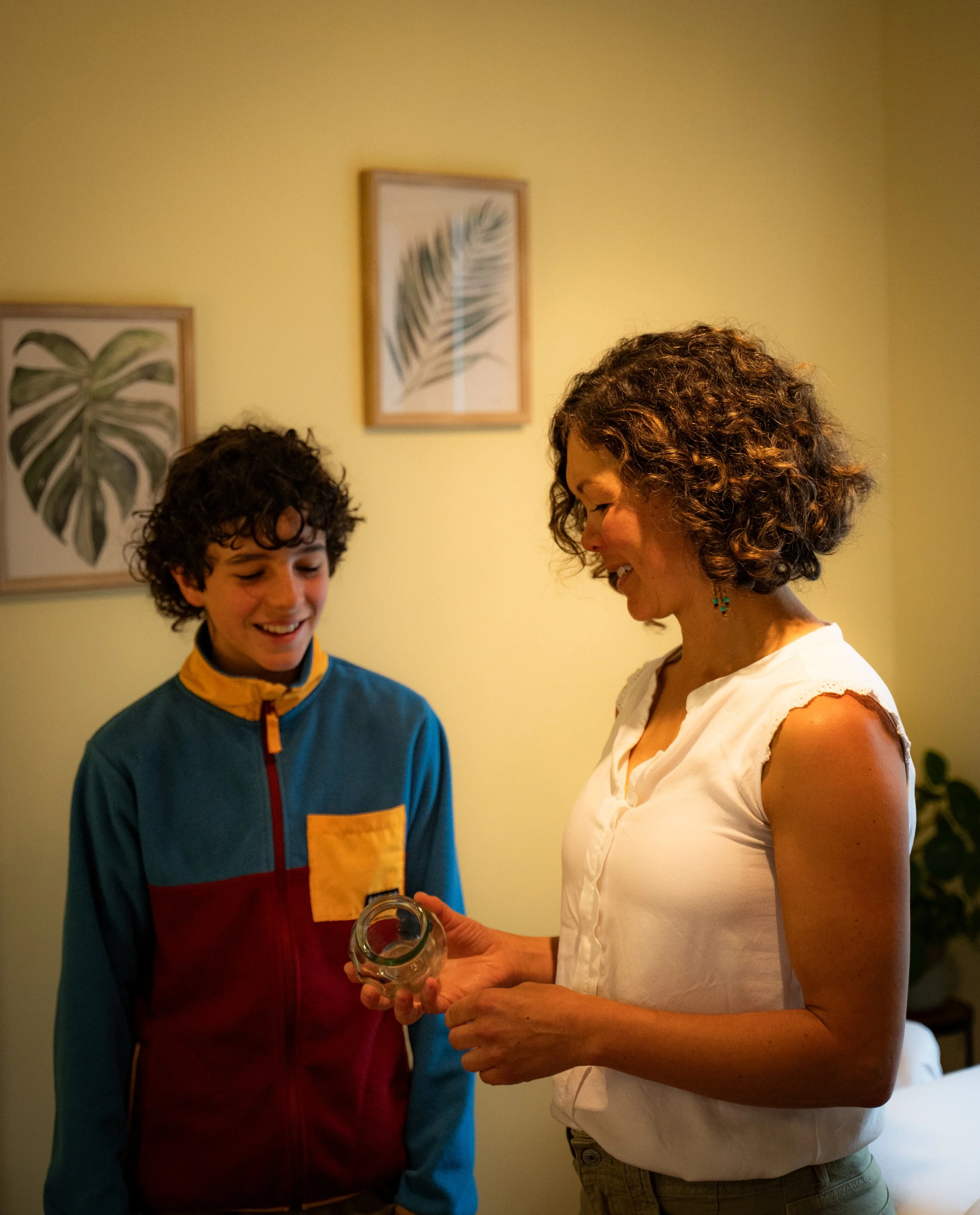 Jasmine explaining to boy how fire cupping works