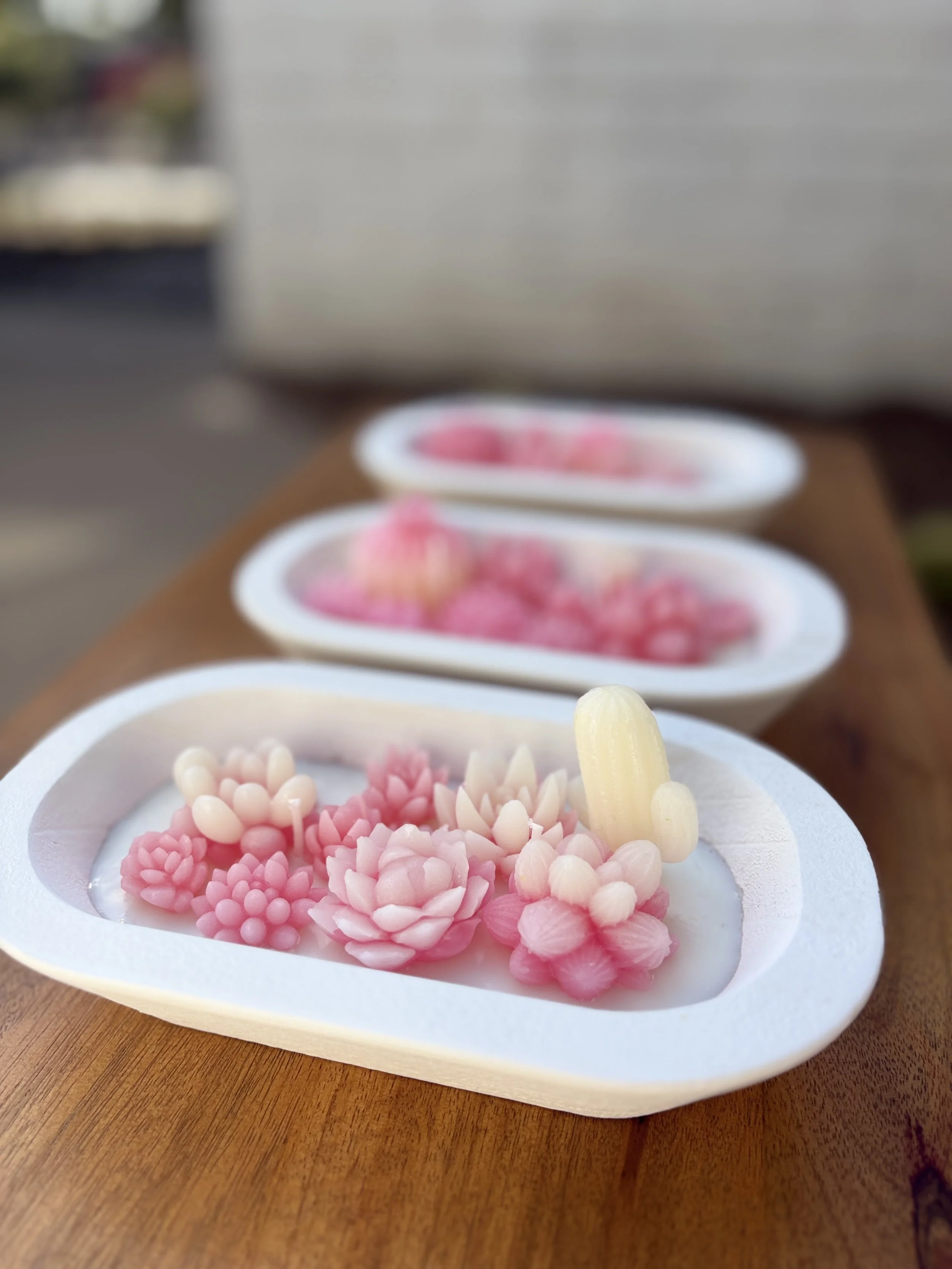 Close-up of delicate pink and white floral-patterned Candle