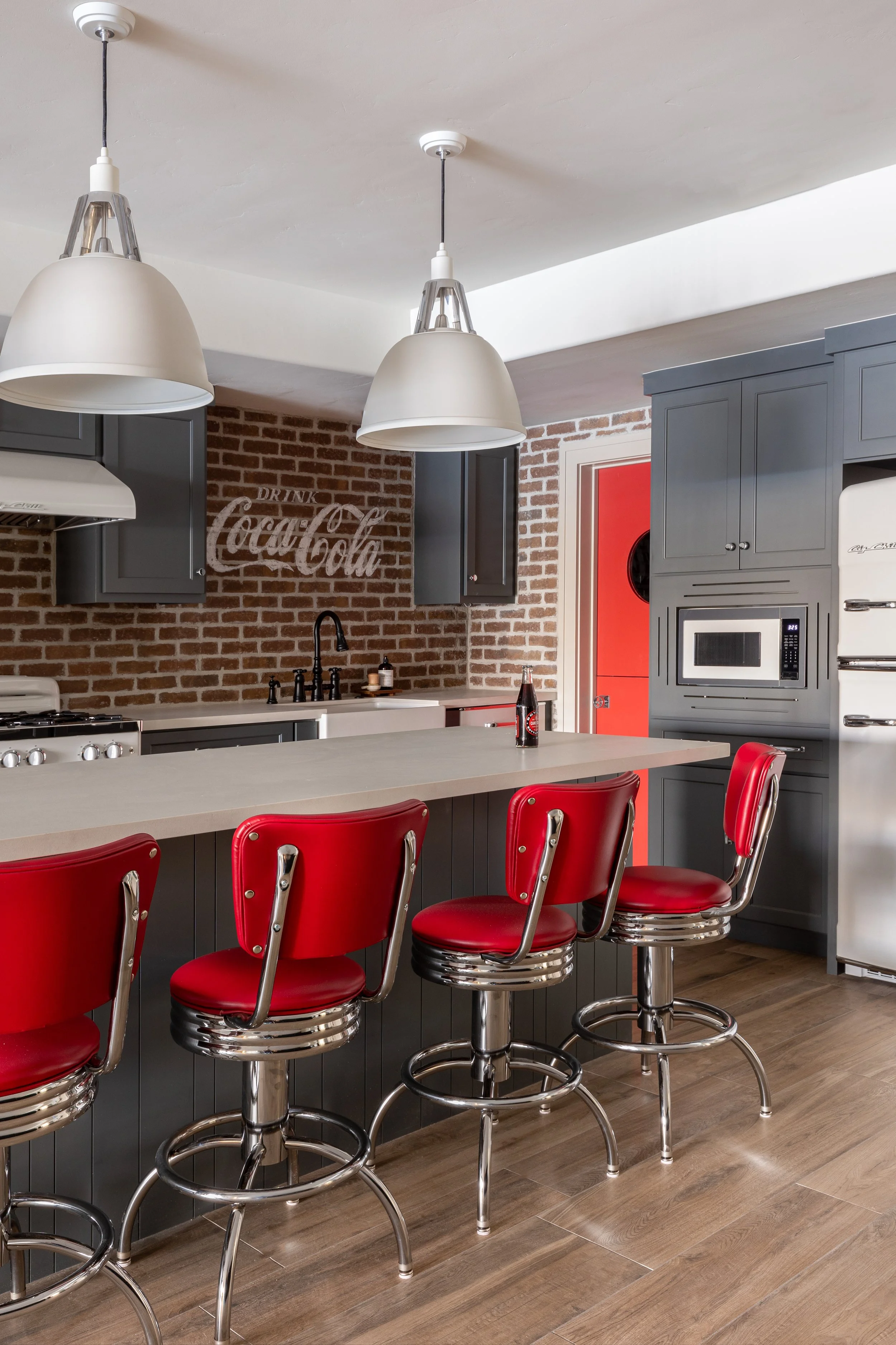 Bespoke Coca-cola themed basement kitchen remodel by VanDyke