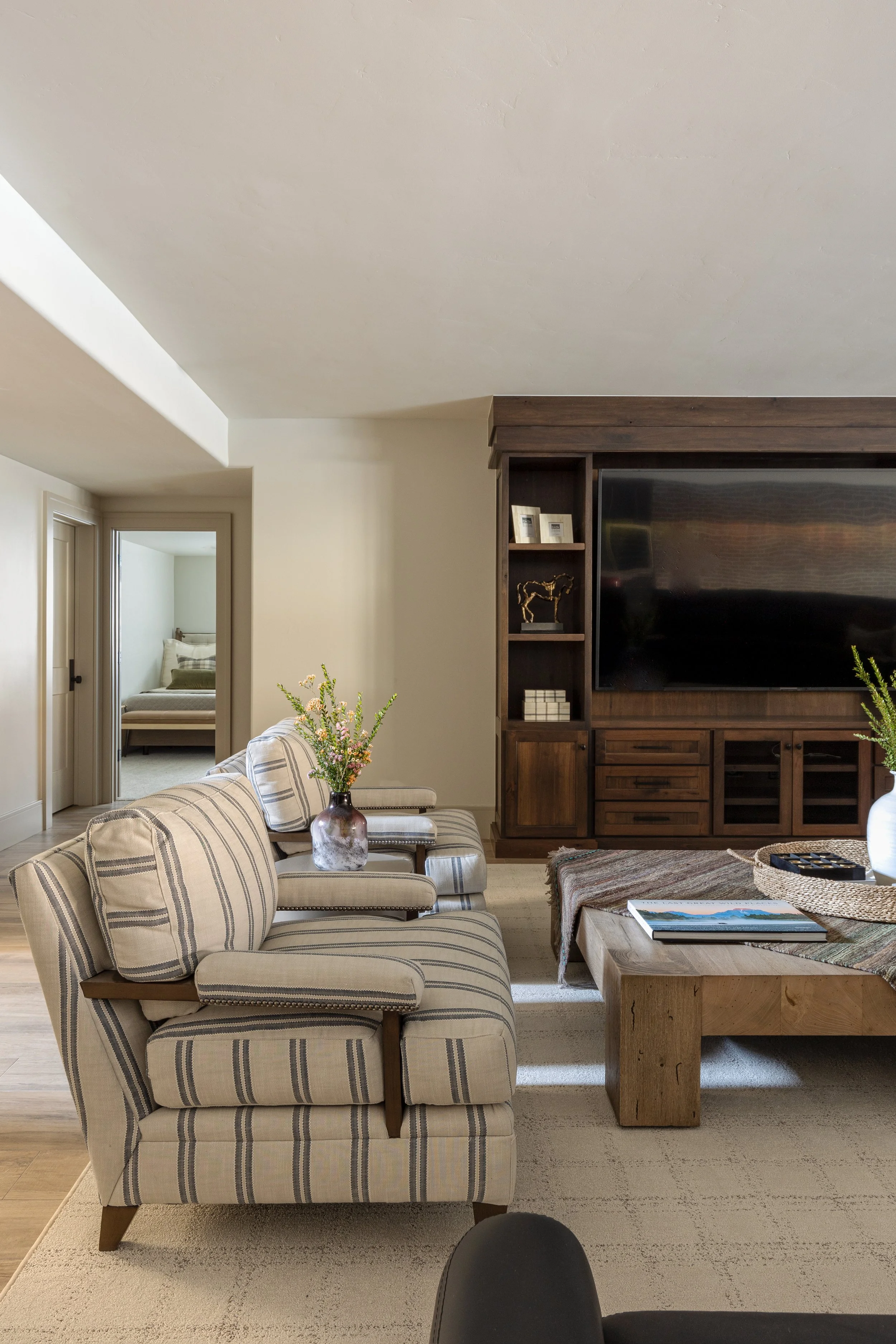 Orem, Utah open-concept finished basement living area built by VanDyke Construction Co.