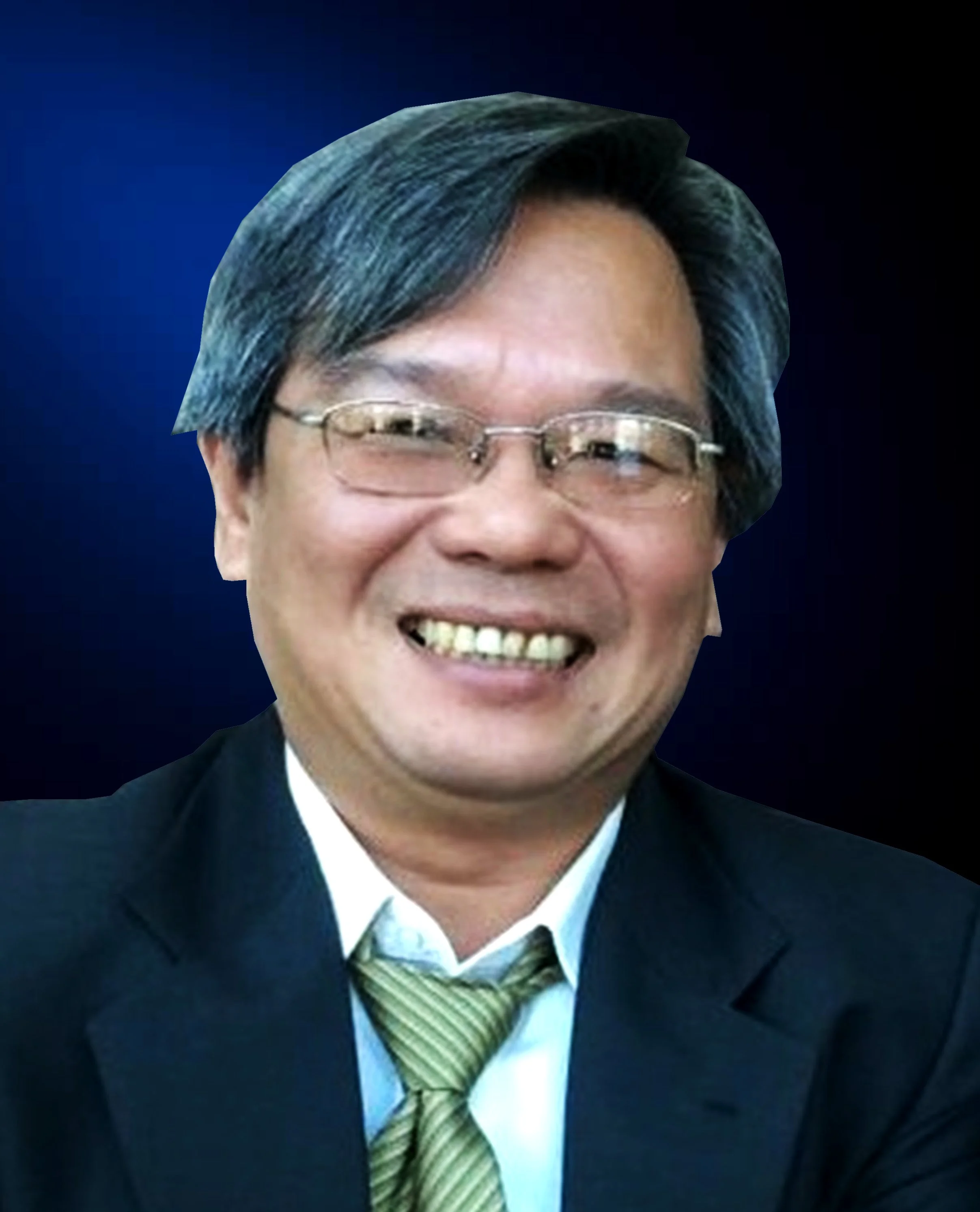 Portrait of a smiling Asian man wearing glasses, a suit, white shirt, and a green tie, with a dark blue background.