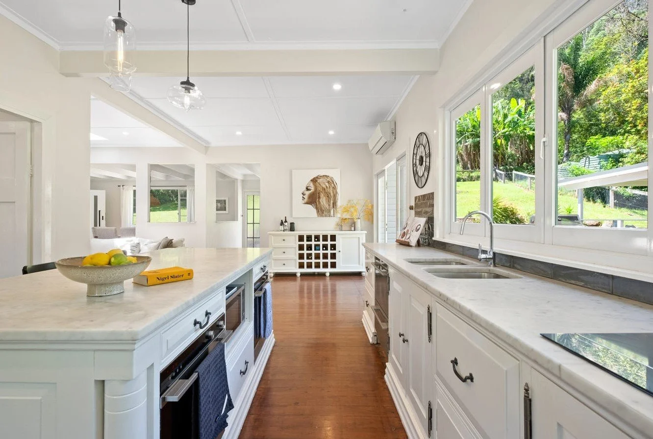 Country kitchen design Matcham Central Coast with marble, natural materials and warm finishes.