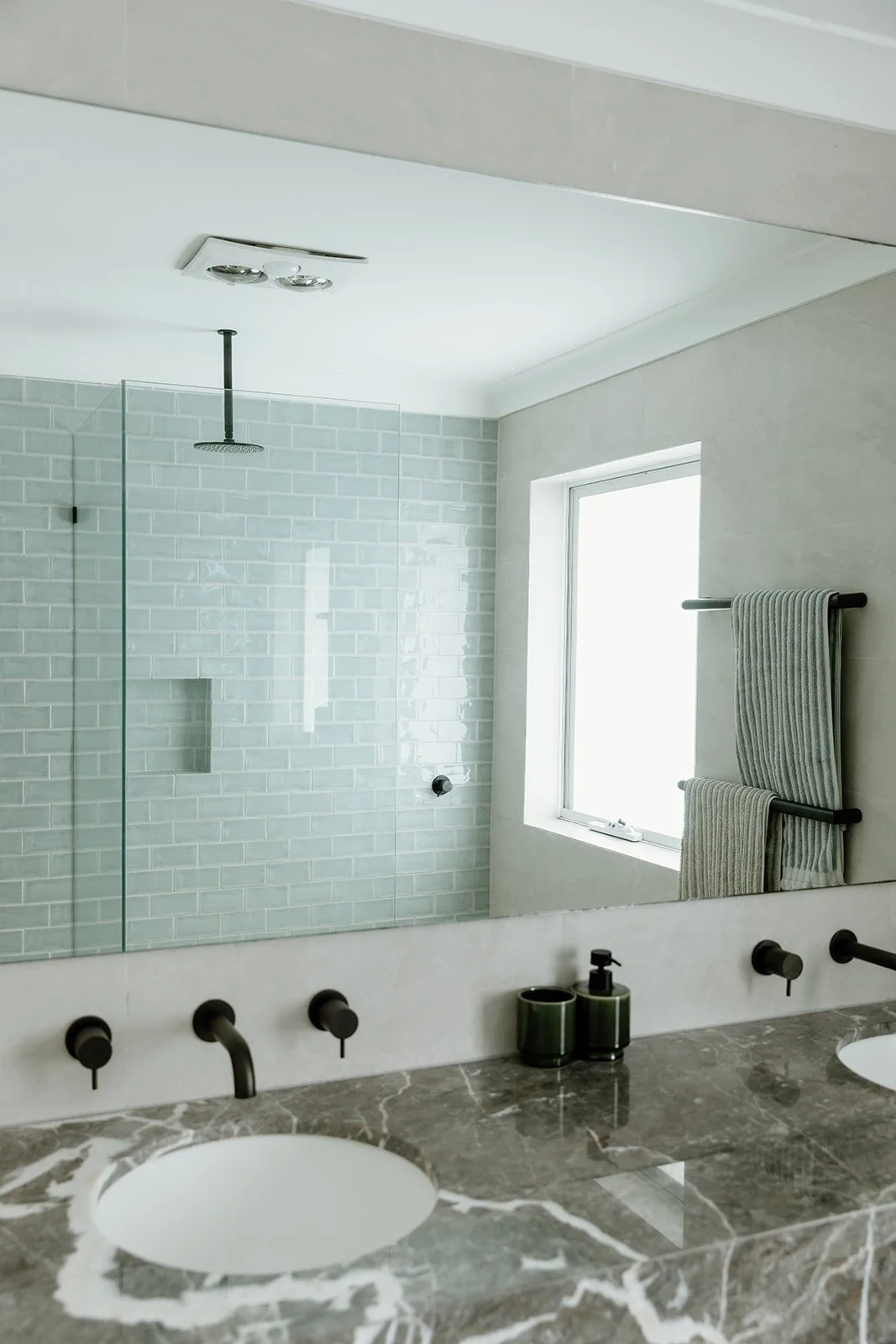 Bathroom renovation Central Coast with warm tones and natural finishes by Everyday Designs. 