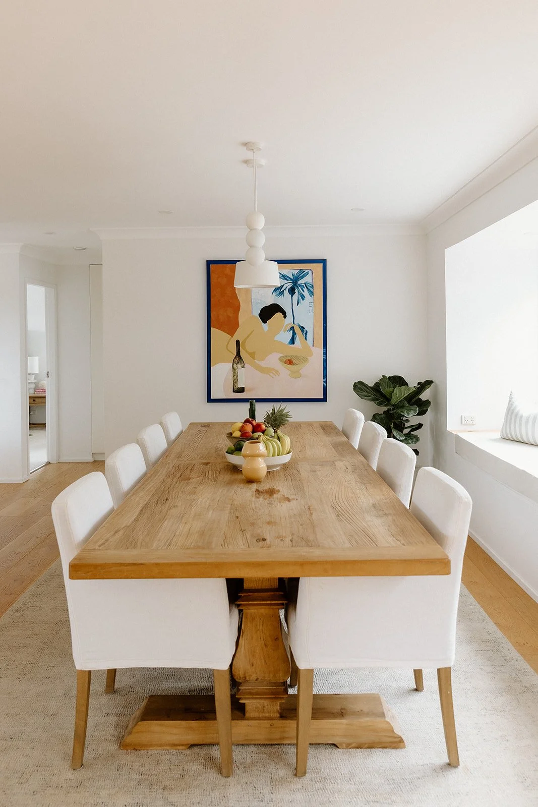 Living and dining space Wamberal Central Coast with natural materials and warm tones. 