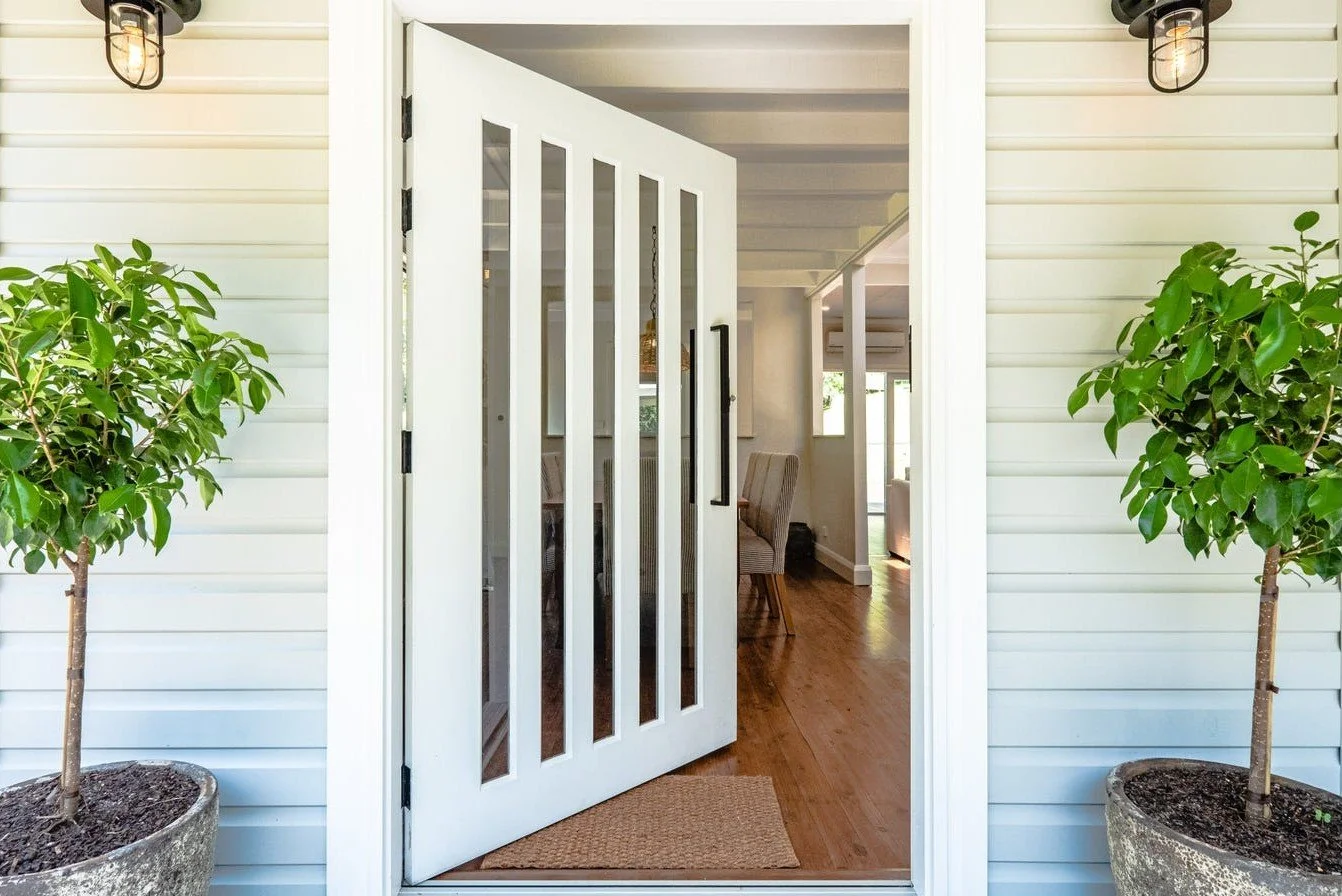 Front entry of Matcham home renovation with natural finishes by Everyday Designs
